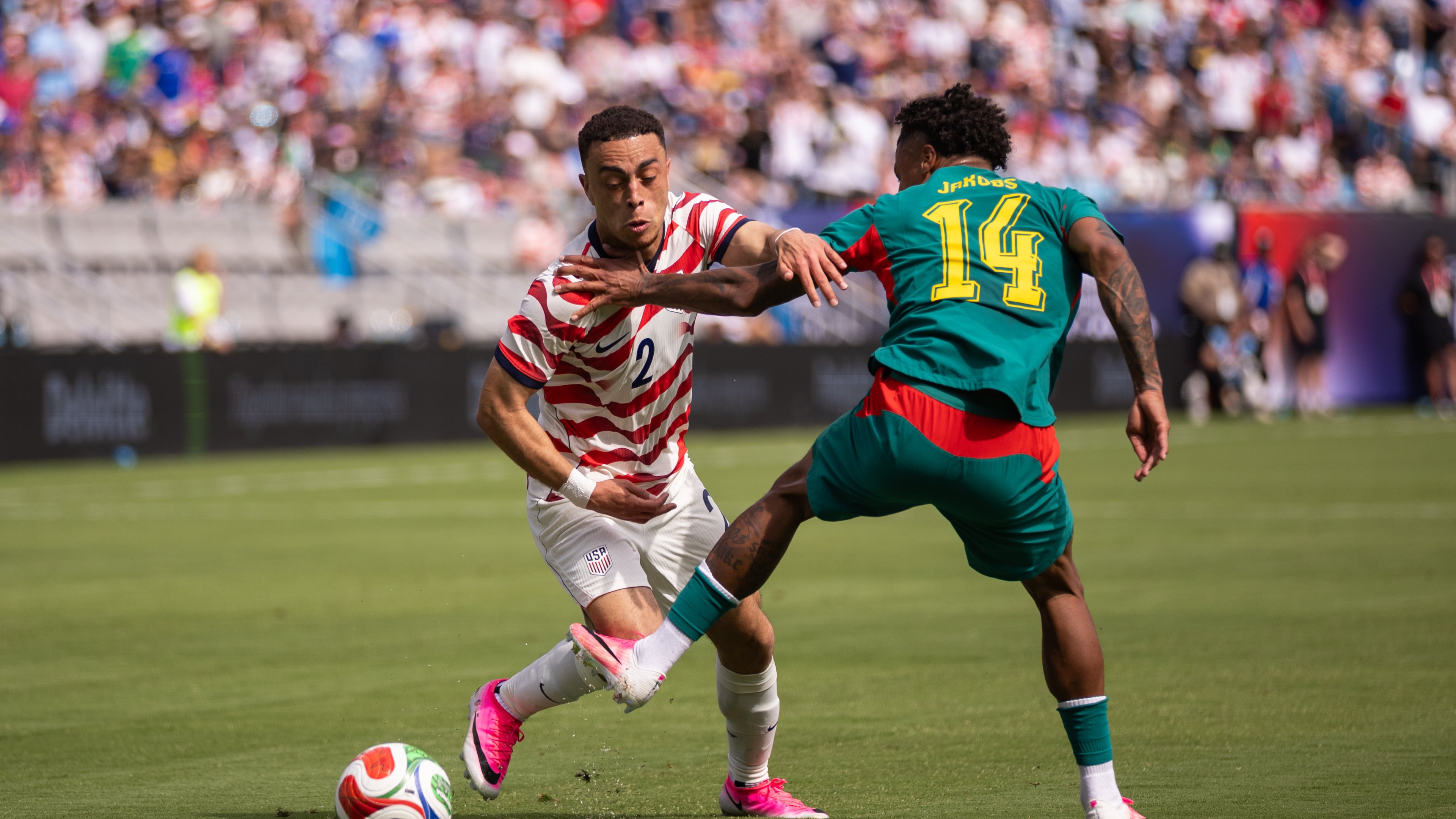 United States defender Sergiño Dest (left) battles with Senegal midfielder Ismail Jakobs during an international friendly Sunday, May 31, 2026, in Charlotte, N.C. (Scott Kinser/AP)