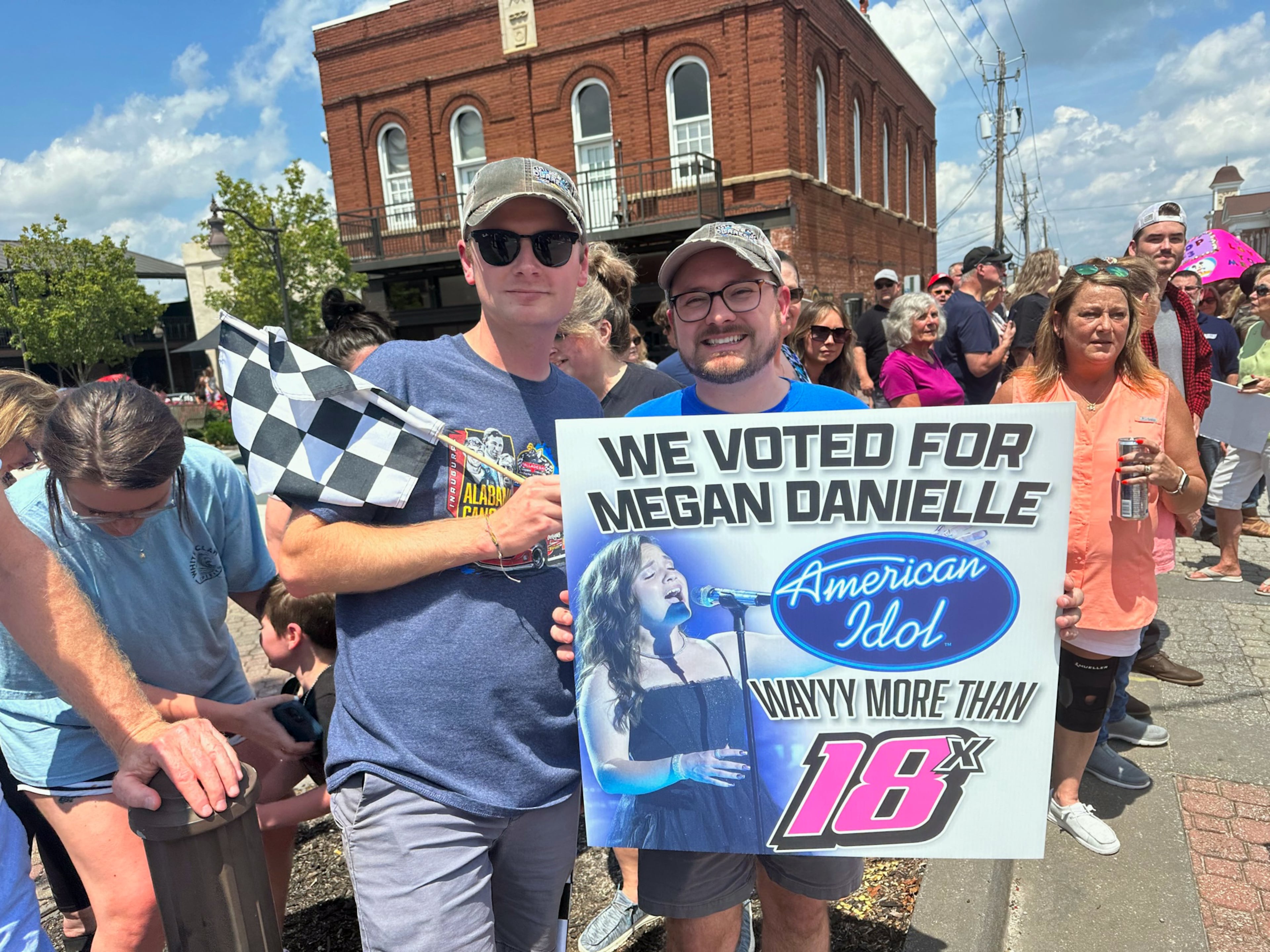 Megan Danielle fans Mitchell Jenkins, 25, and his boyfriend Hayden Gay, 28, drove from Alabama to see her. They know her uncle, who is in racing. "She has a good hometown feel," Jenkins said. "She's very humble." RODNEY HO/rho@ajc.com
