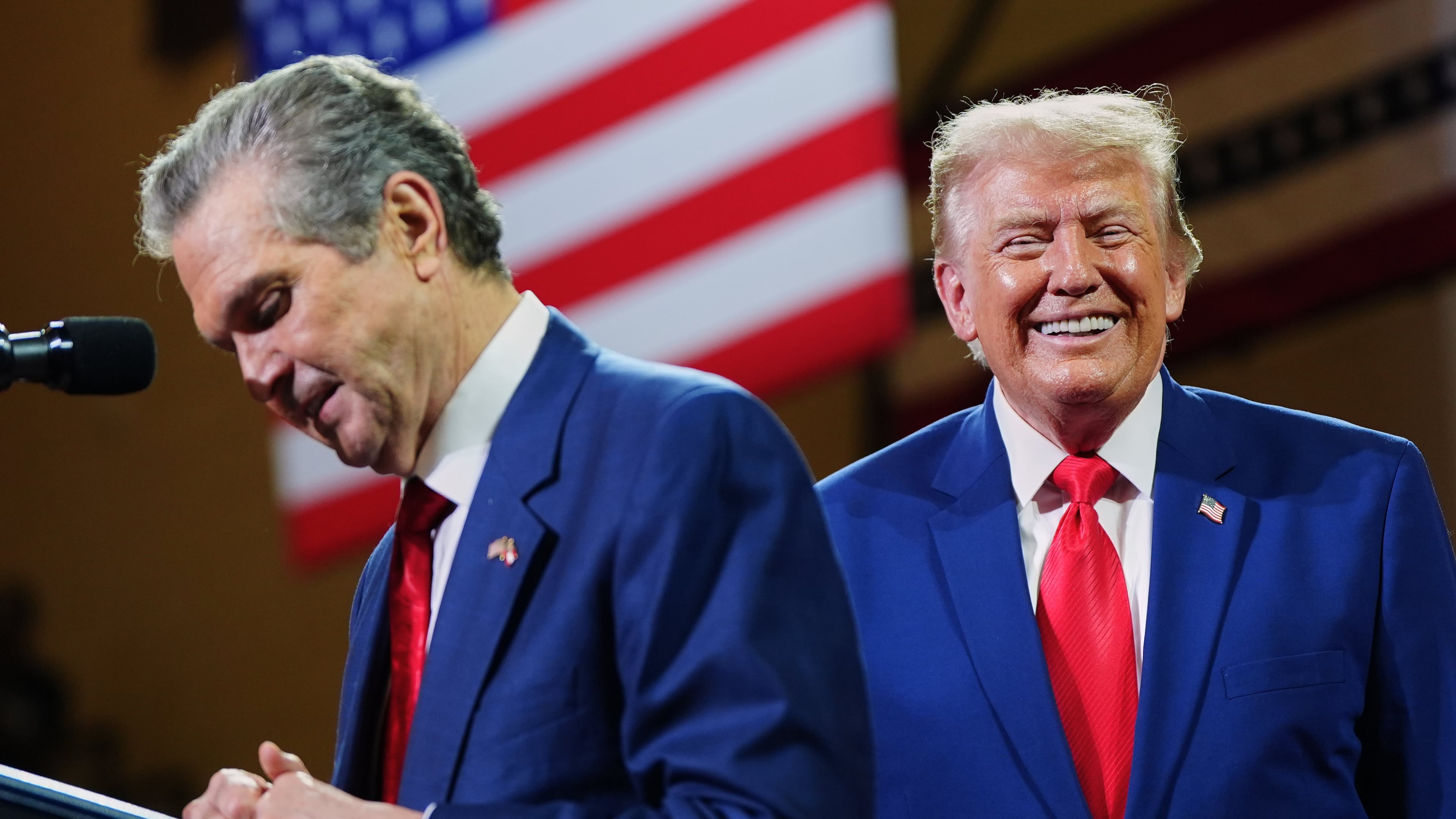 President Donald Trump listens to Georgia Republican nominee for governor Rick Jackson speak at Wheeler High School on Wednesday. (Julia Demaree Nikhinson/AP)