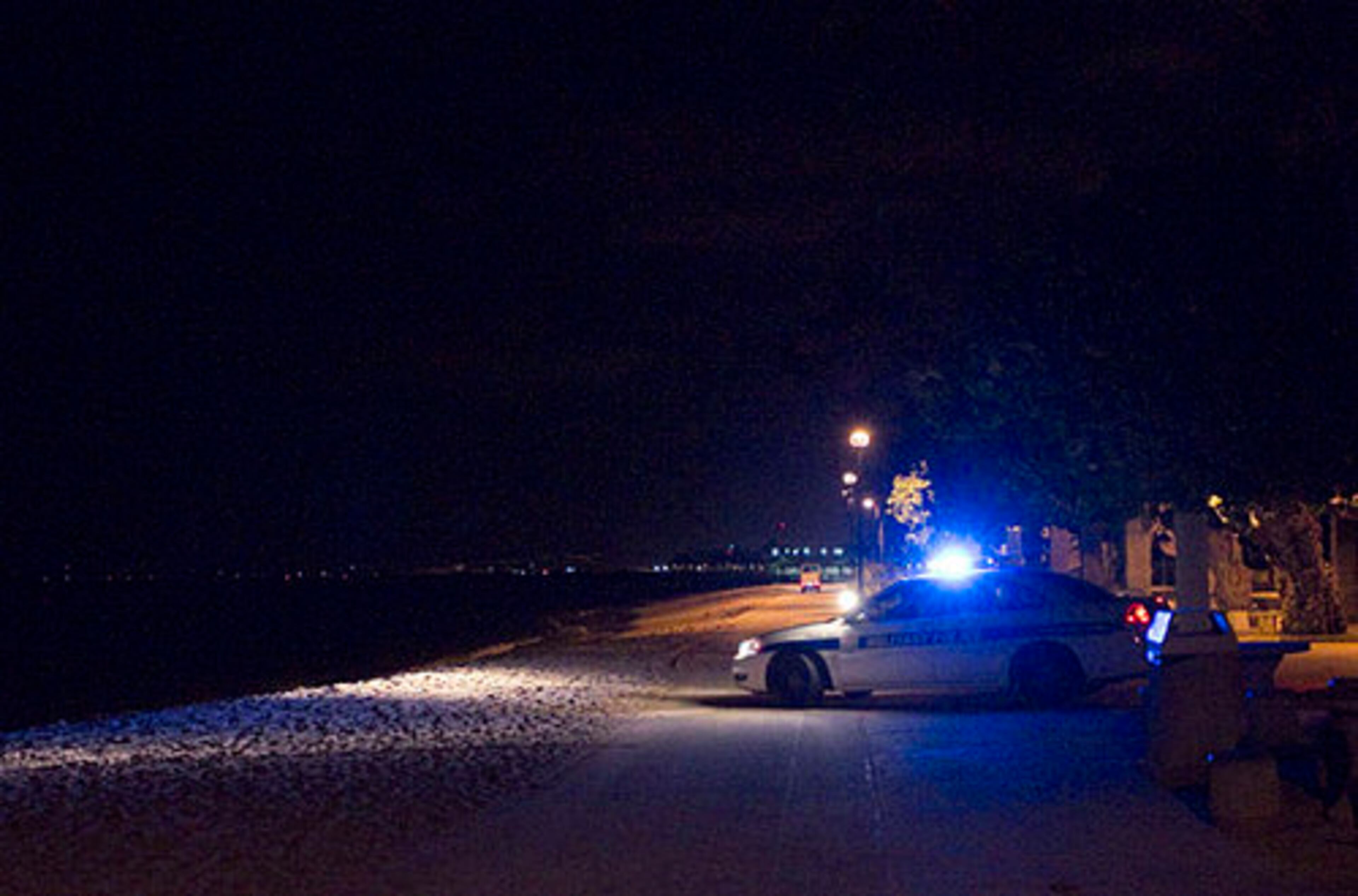 A Honolulu police car drives down Waikiki Beach warning people about an approaching tsunami, Friday, March 11, 2011 in Honolulu.