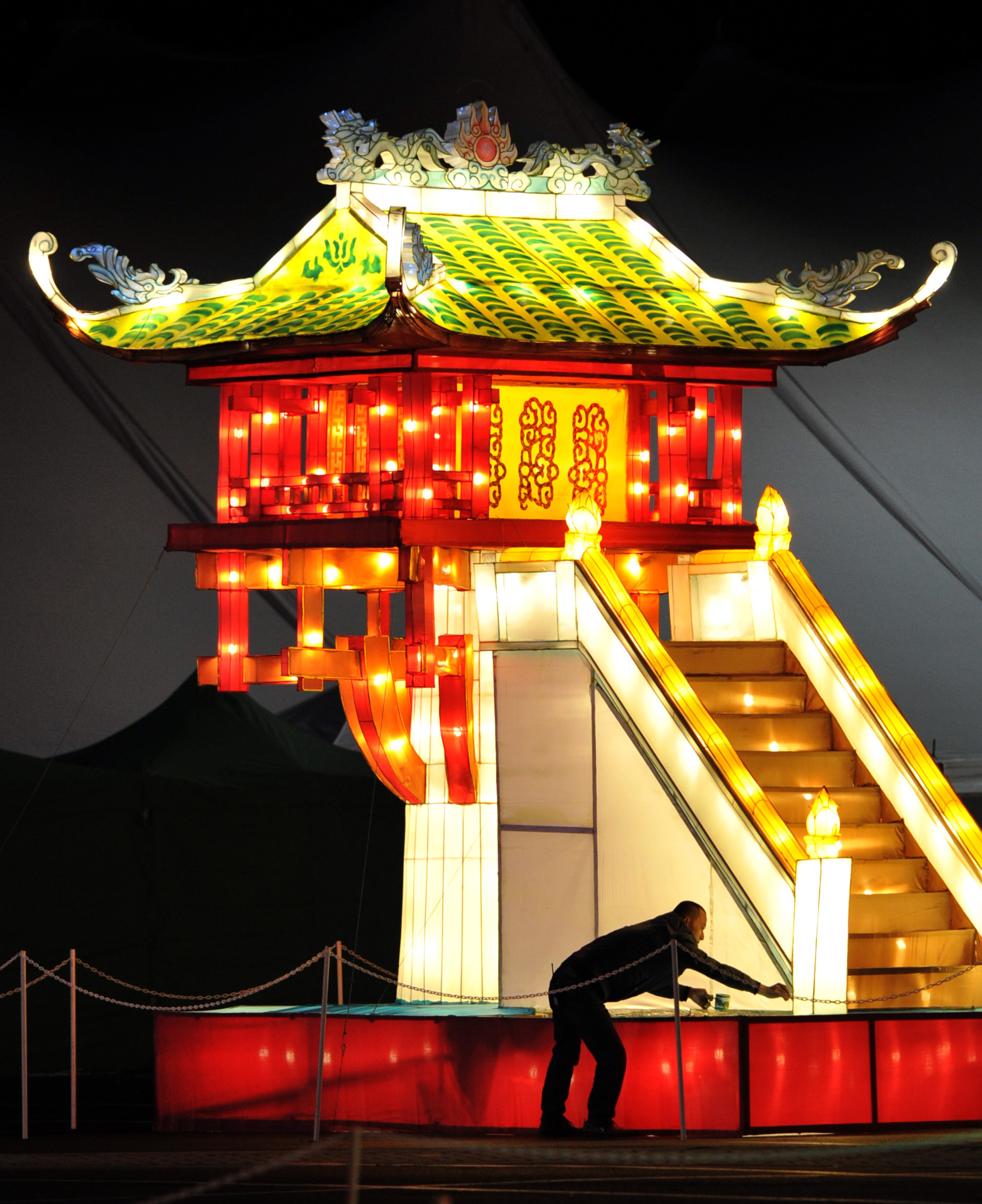 November 19, 2013 Atlanta - Event staff gives the final check before the opening of Global Winter Wonderland Atlanta in the Green Lot at Turner Field on Friday, November 19, 2013. The largest such festival ever presented outside of China, the 2011 U.S. premiere of Global Winter Wonderland featured giant illuminated lanterns depicting creatures and scenes that included a Christmas holiday village, animals real and imagined, and people and scenes from around the world. Global Winter Wonderland Atlanta will be open daily 5pm to 11pm from November 21, 2013 - January 5, 2014. HYOSUB SHIN / HSHIN@AJC.COM