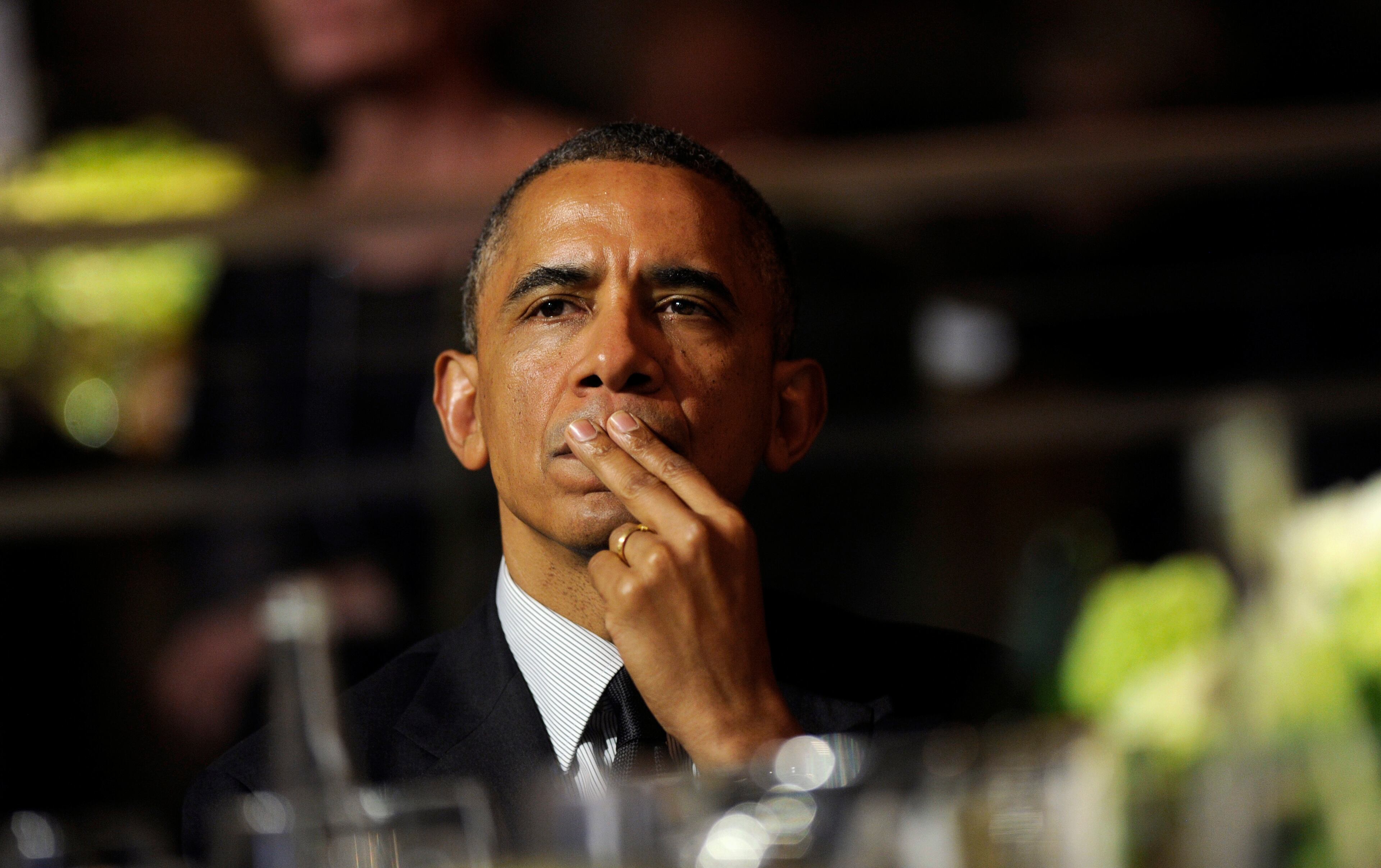 President Barack Obama listens to the remarks of movie director Steven Spielberg as he attends the USC Shoah Foundation's 20th anniversary Ambassadors for Humanity gala in Los Angeles, Wednesday, May 7, 2014. Obama received an award from the foundation created by Spielberg and planned to spend three days in California where he will raise money for the Democratic Party. (AP Photo/Susan Walsh)