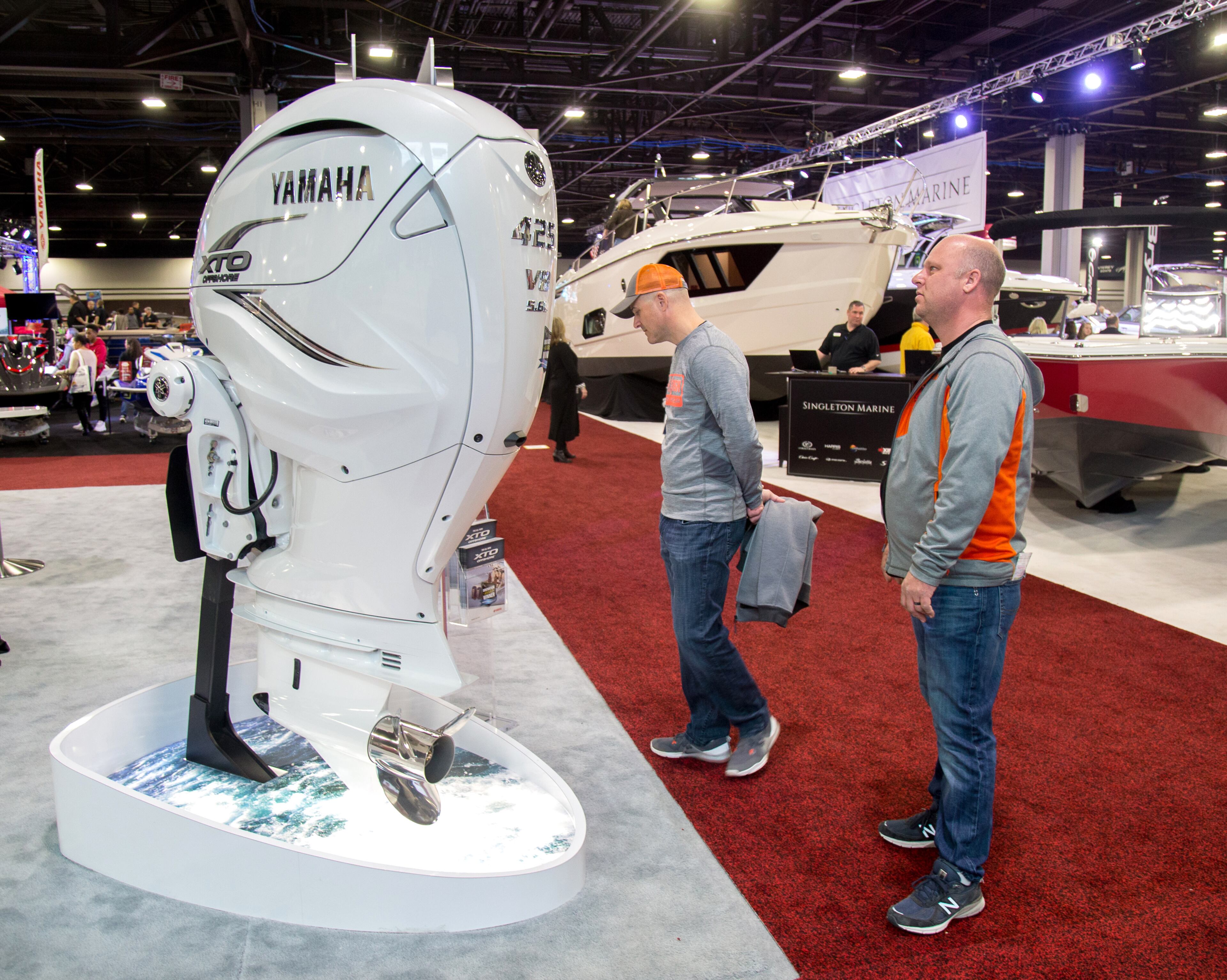 Joe Alissandrello (L) and Bryan Summers (R) look over a 425 horsepower, V8 outboard motor at the 2019 Progressive Atlanta Boat Show at the Georgia World Congress Center in Atlanta on January 12, 2019. The show which opened Thursday and runs through Sunday is expected to draw an estimated 20,000 people. STEVE SCHAEFER / SPECIAL TO THE AJC