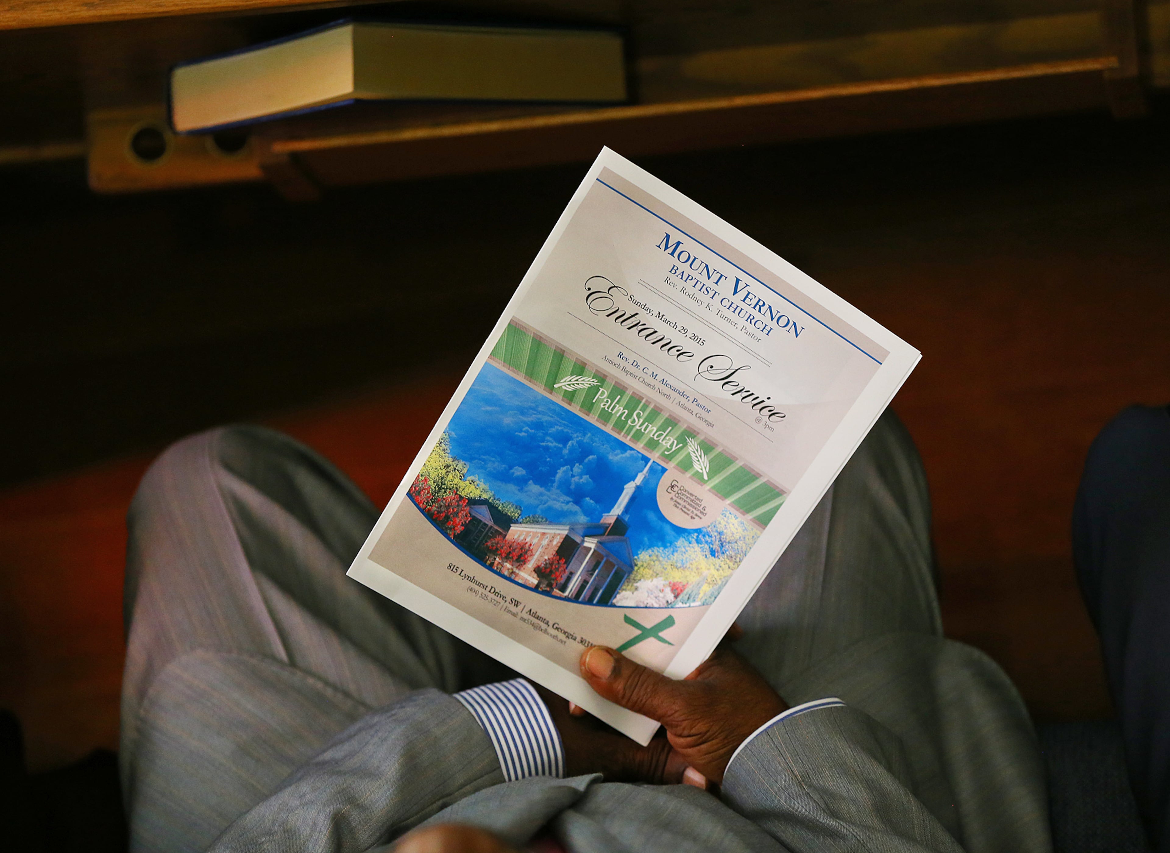 A church member holds his bulletin in his pew during the Entrance Service at Mount Vernon Baptist Church on Palm Sunday, March 29, 2015, in Atlanta. Curtis Compton / ccompton@ajc.com