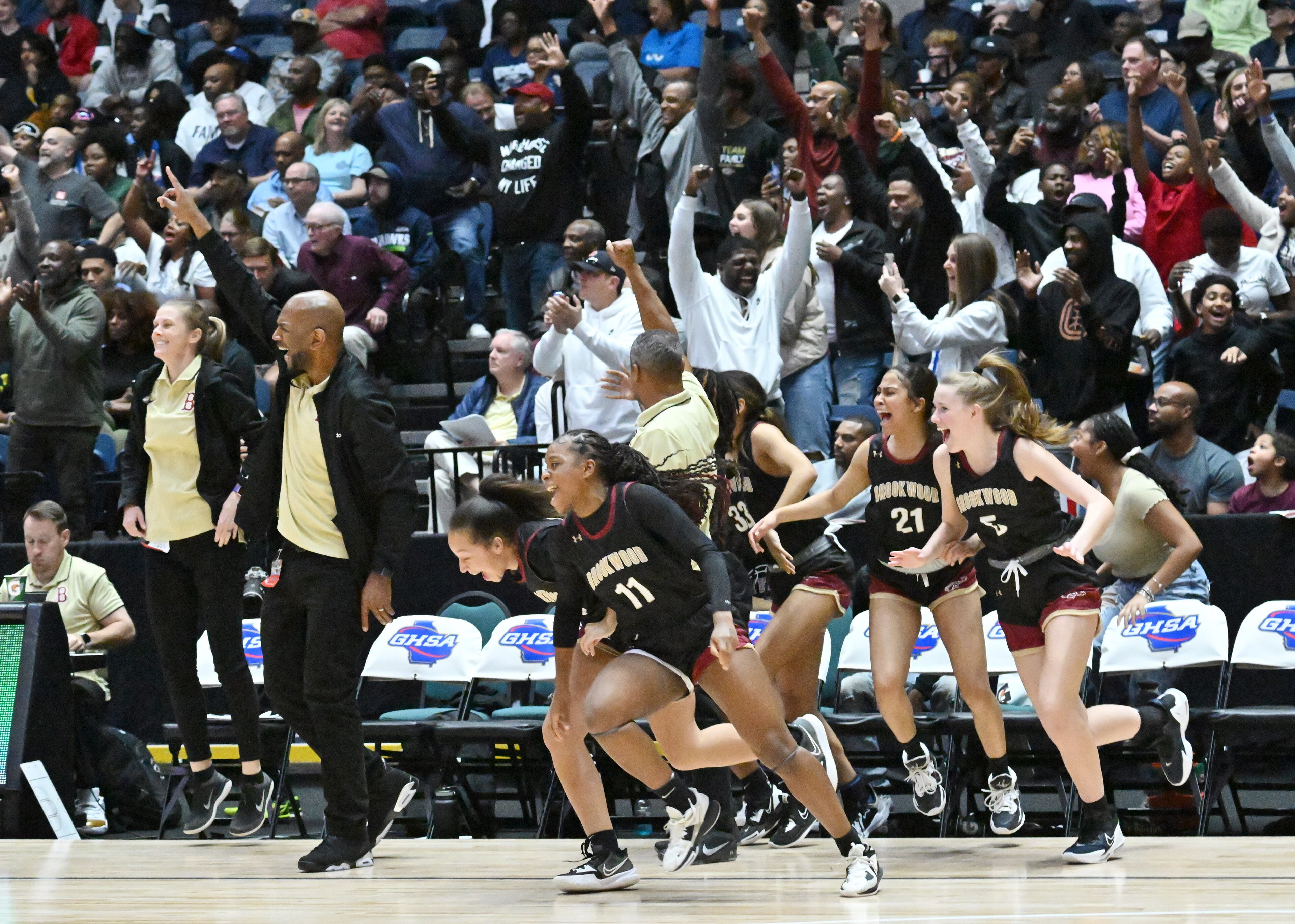 Brookwood players celebrate. (Hyosub Shin / Hyosub.Shin@ajc.com)