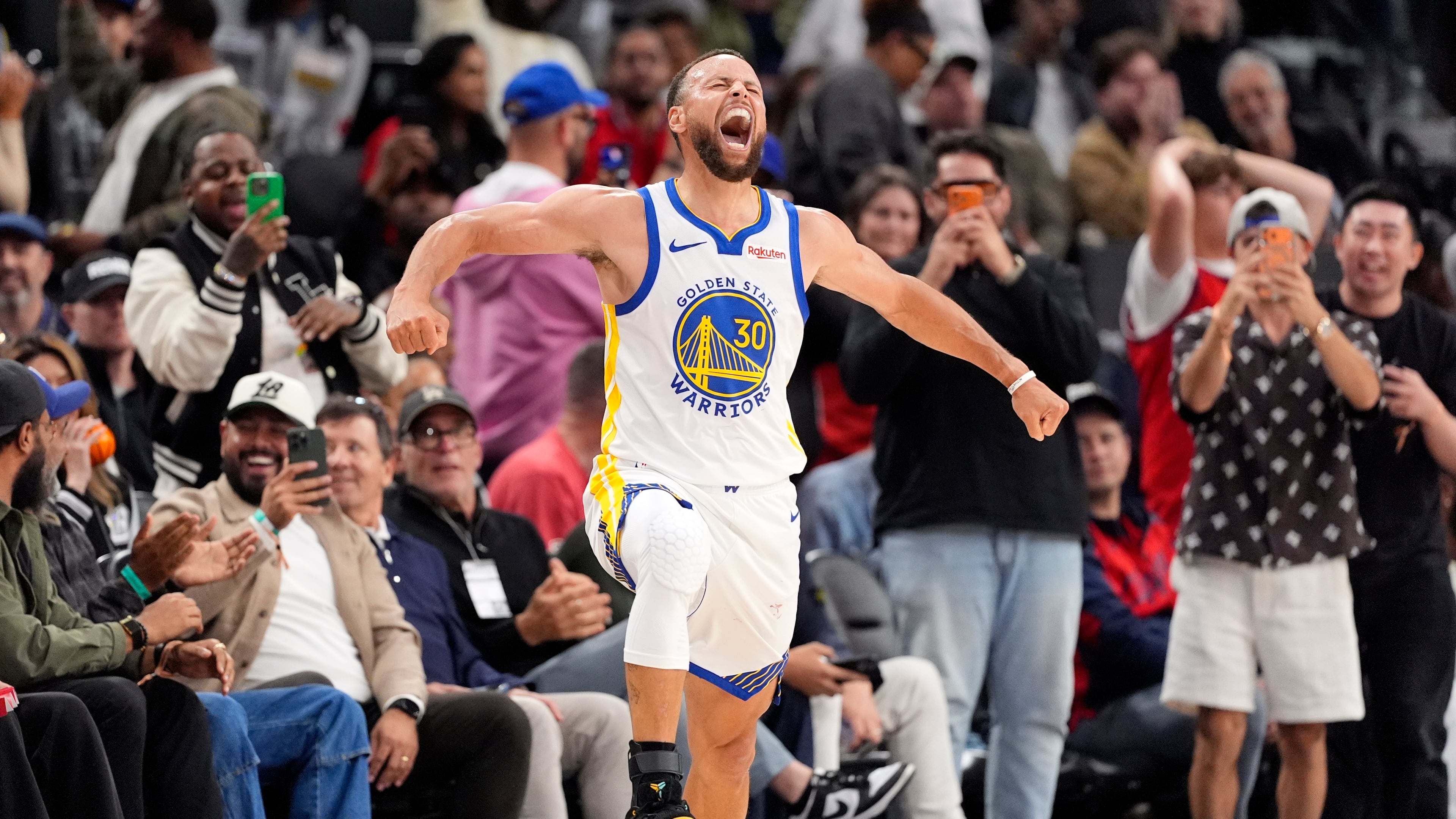 Golden State Warriors guard Stephen Curry celebrates after scoring during the second half of an NBA play-in tournament basketball game against the LA Clippers, Wednesday, April 15, 2026, in Inglewood, Calif. (AP Photo/Mark J. Terrill)