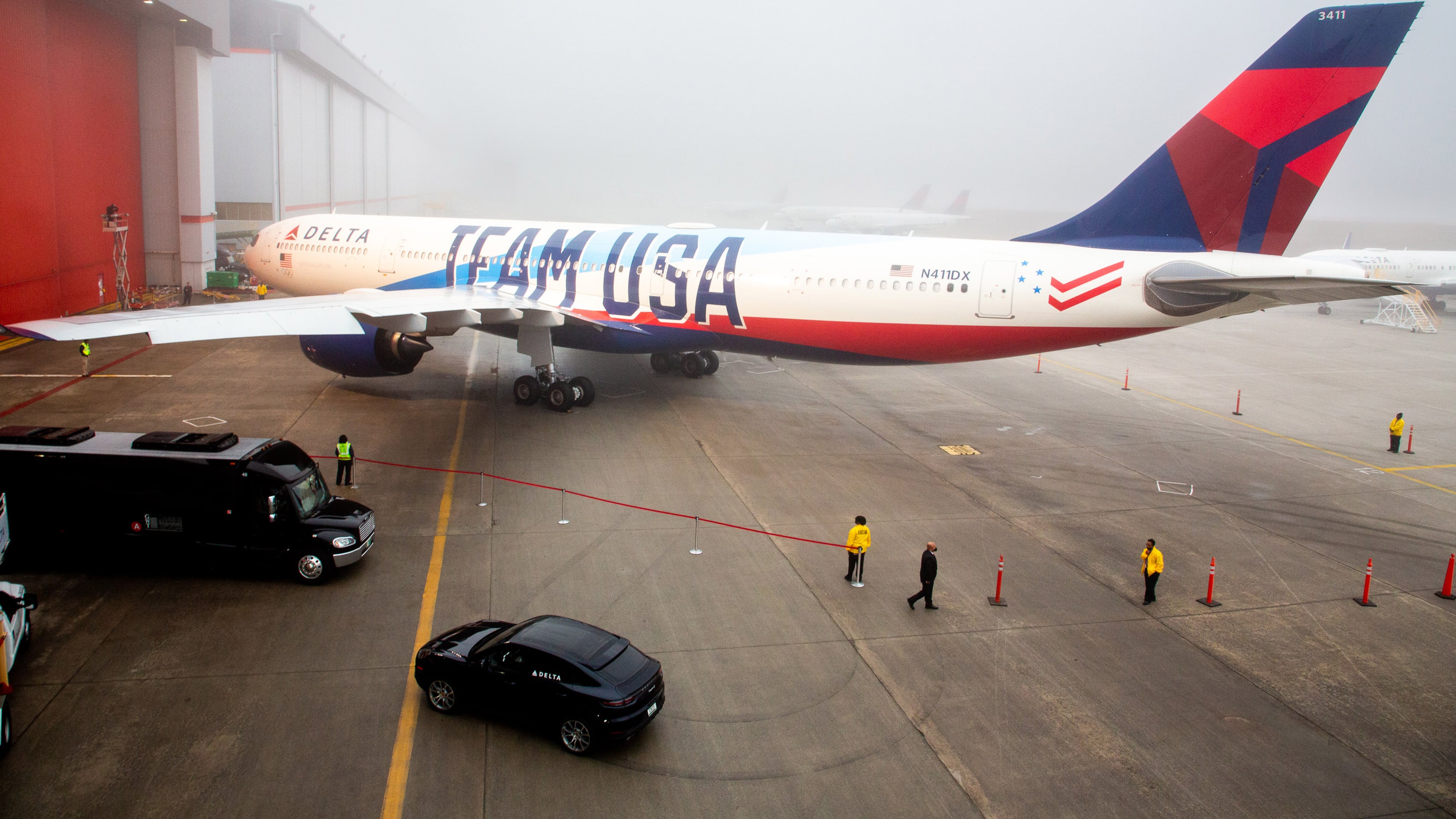 Delta employees prepare the area around Delta's new Team USA plane. Delta will be an Olympic sponsor and Team USA's official airline. STEVE SCHAEFER FOR THE ATLANTA JOURNAL-CONSTITUTION