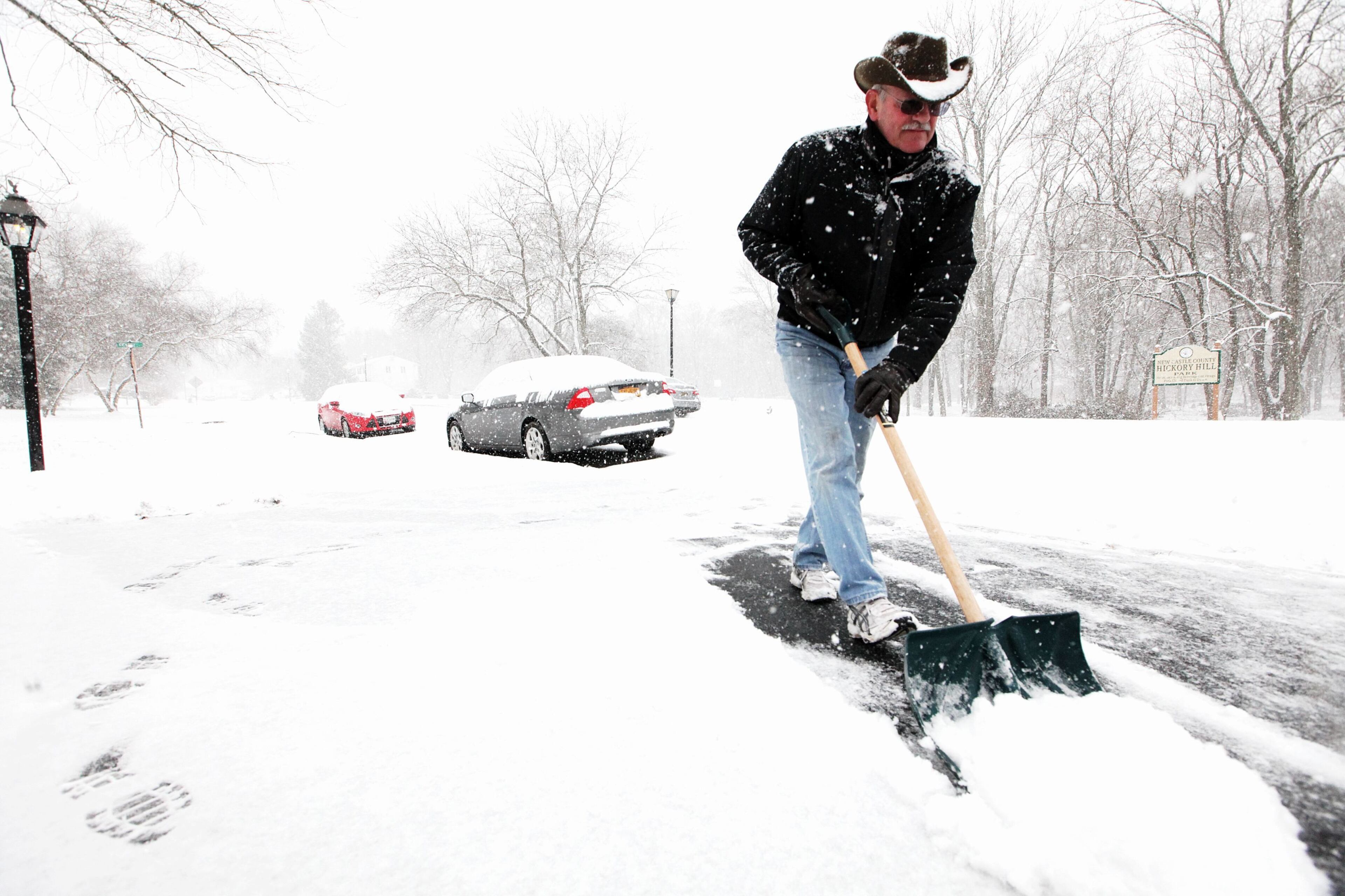 Bob Gannon of Hockessin, Del., says he has a snow blower but decides to use a snow shovel for now as the first snow of the season rolls into the region, Sunday, Dec. 8, 2013.