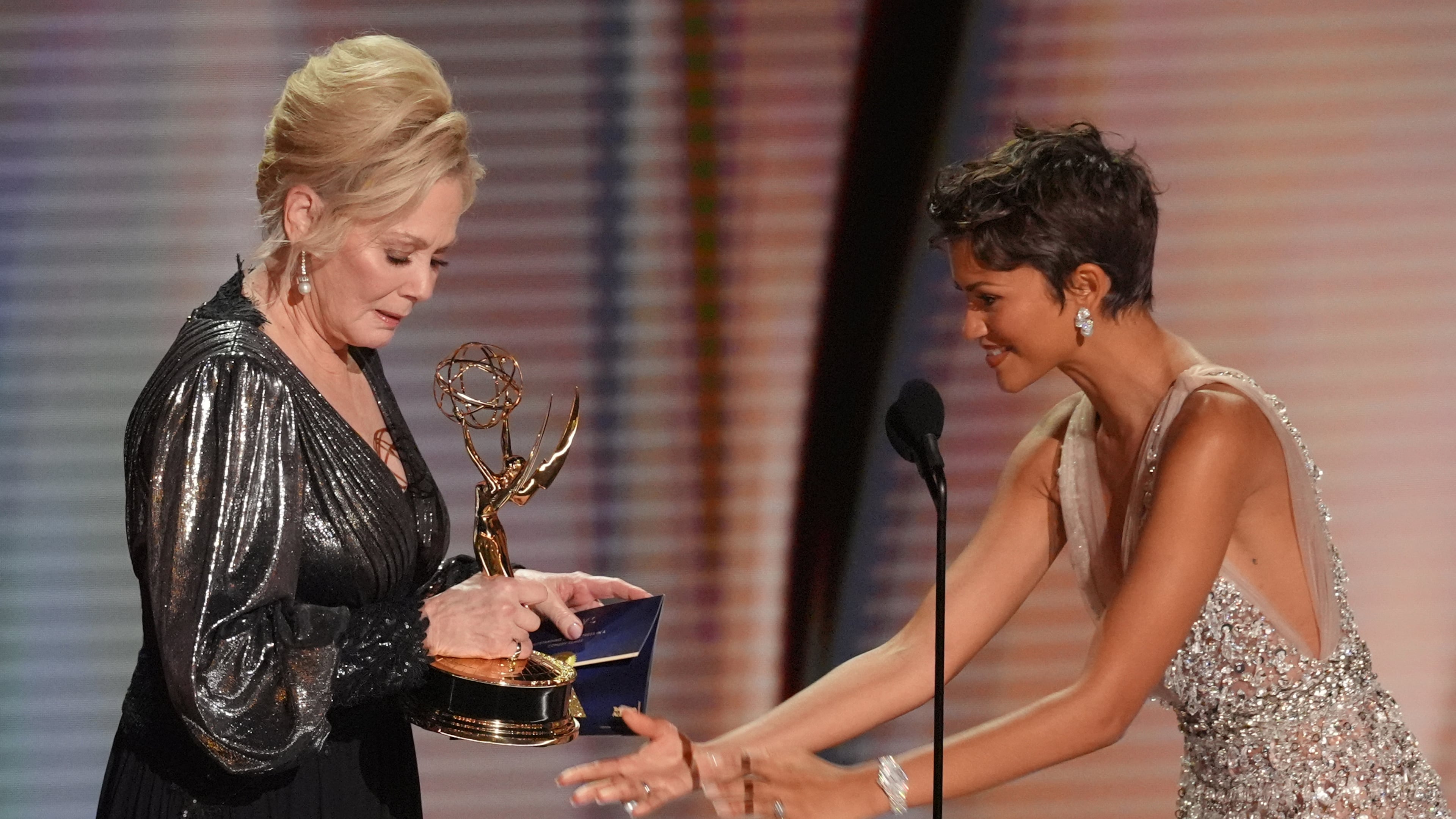 Zendaya, right, presents the award for outstanding lead actress in comedy series to Jean Smart, left, for "Hacks" during the 78th Emmy Awards on Monday, Sept. 14, 2026, at the Peacock Theater in Los Angeles. (AP Photo/Chris Pizzello)