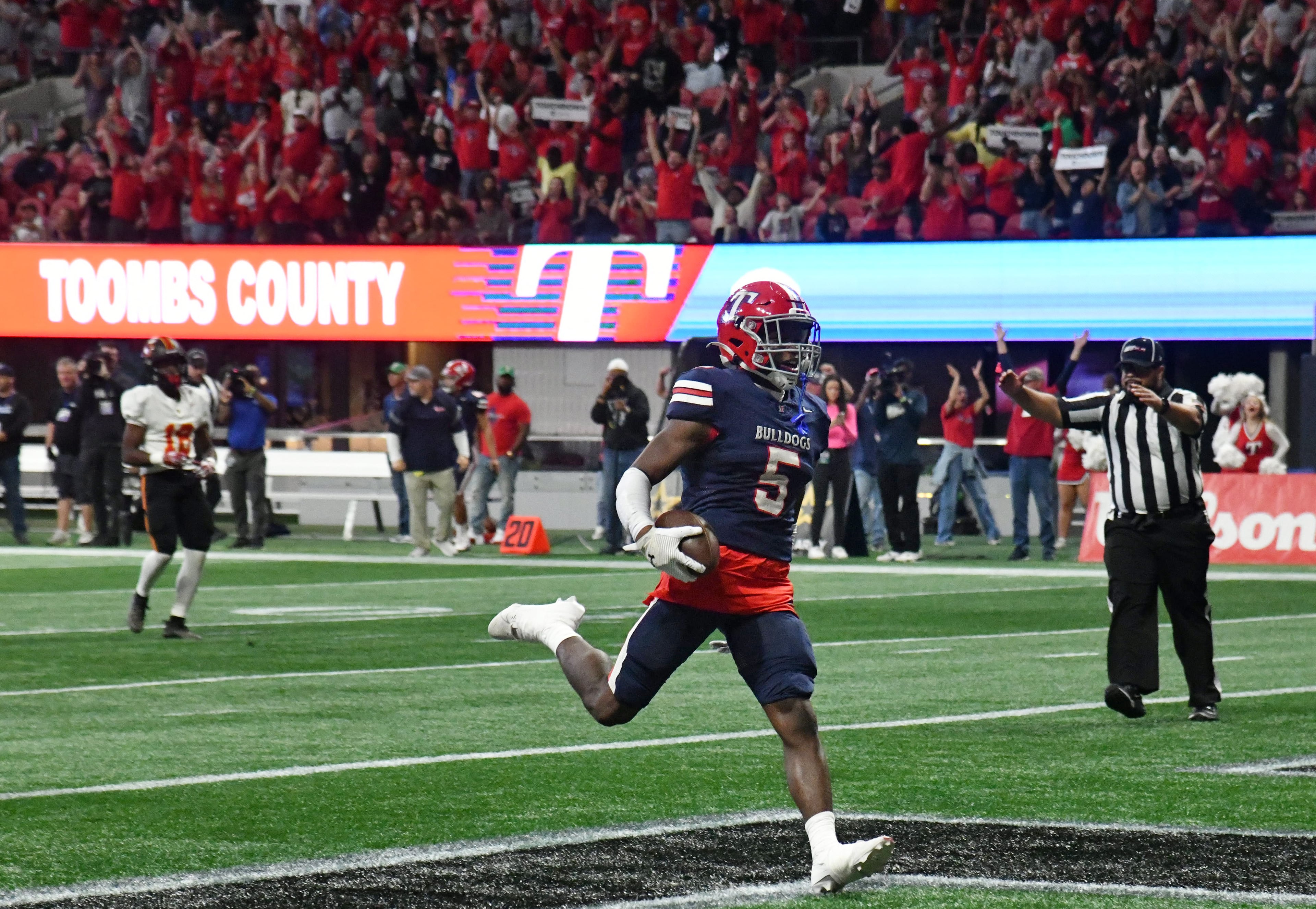 Toombs County's wide receiver Mike Polke (5) scores a touchdown during the first half in GHSA Class A-Division State Championship game at Mercedes-Benz Stadium, Tuesday, December 17, 2024, in Atlanta. (Hyosub Shin / AJC)