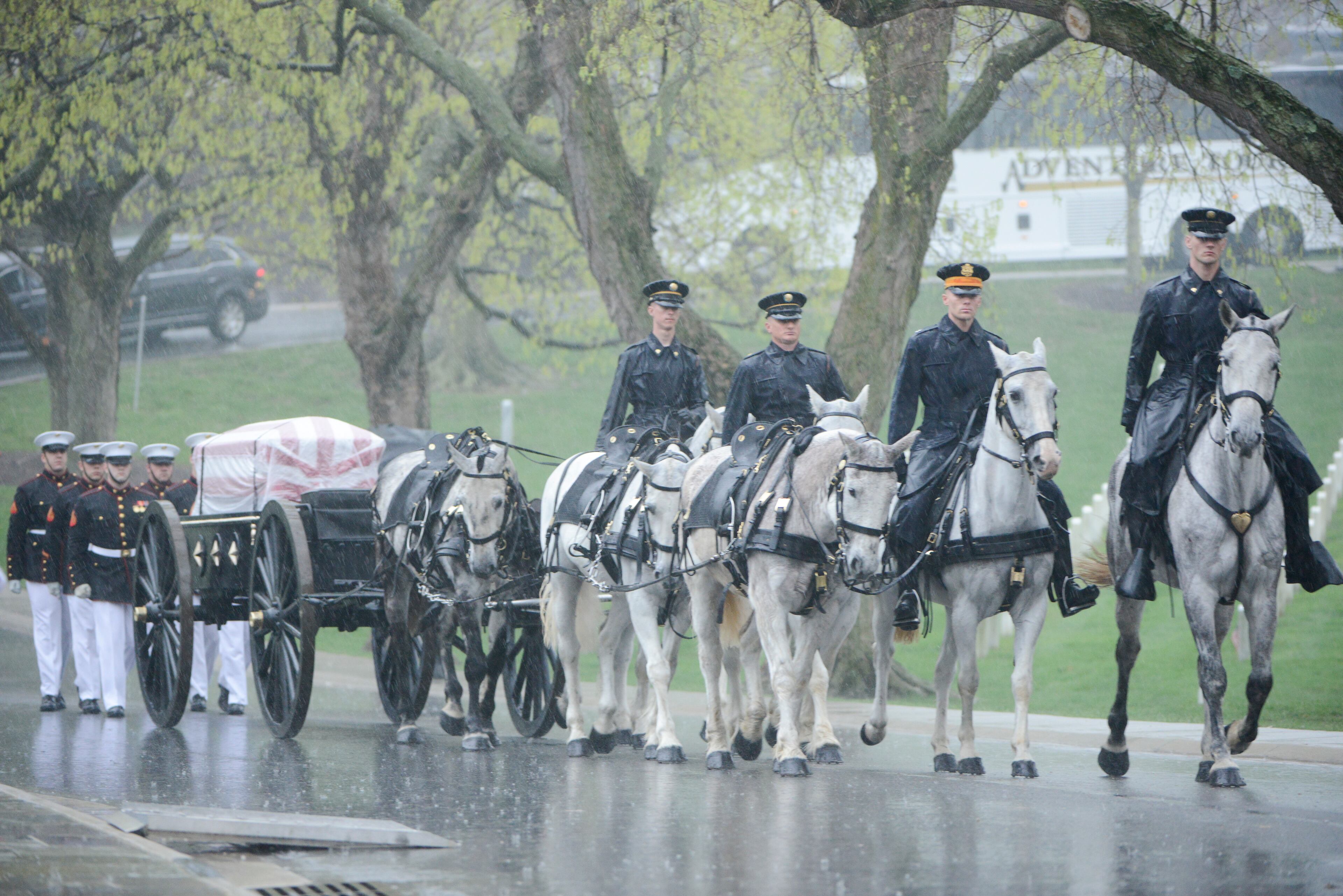 Members of the U.S. Marine Corps, from Marine Barracks Washington, and the U.S. Army Caisson Platoon, part of the 3d U.S. Infantry Regiment (The Old Guard), participate in the graveside service for John Glenn in Section 35 of Arlington National Cemetery, April 6, 2017, in Arlington, Va. Glenn, the first American astronaut to orbit the Earth and later a United States senator, died at the age of 95 on Dec. 8, 2016. (U.S. Army photo by Rachel Larue/Arlington National Cemetery/released)