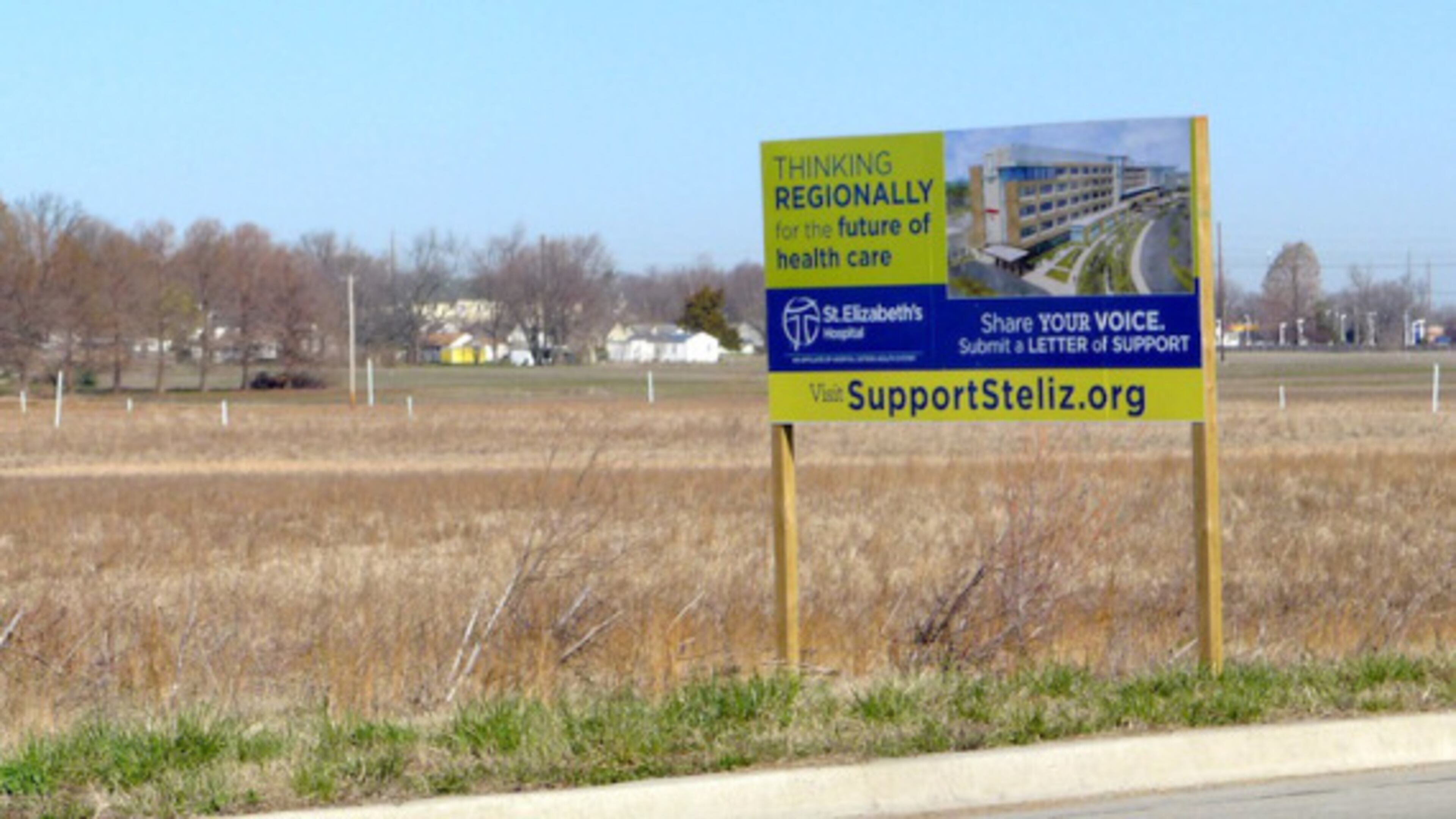 A sign marks the location of a proposed new St. Elizabeth’s hospital in O’Fallon, Mo., on 114 acres of farmland just off Interstate 64 in Illinois. (Photo by Phil Galewitz/KHN)