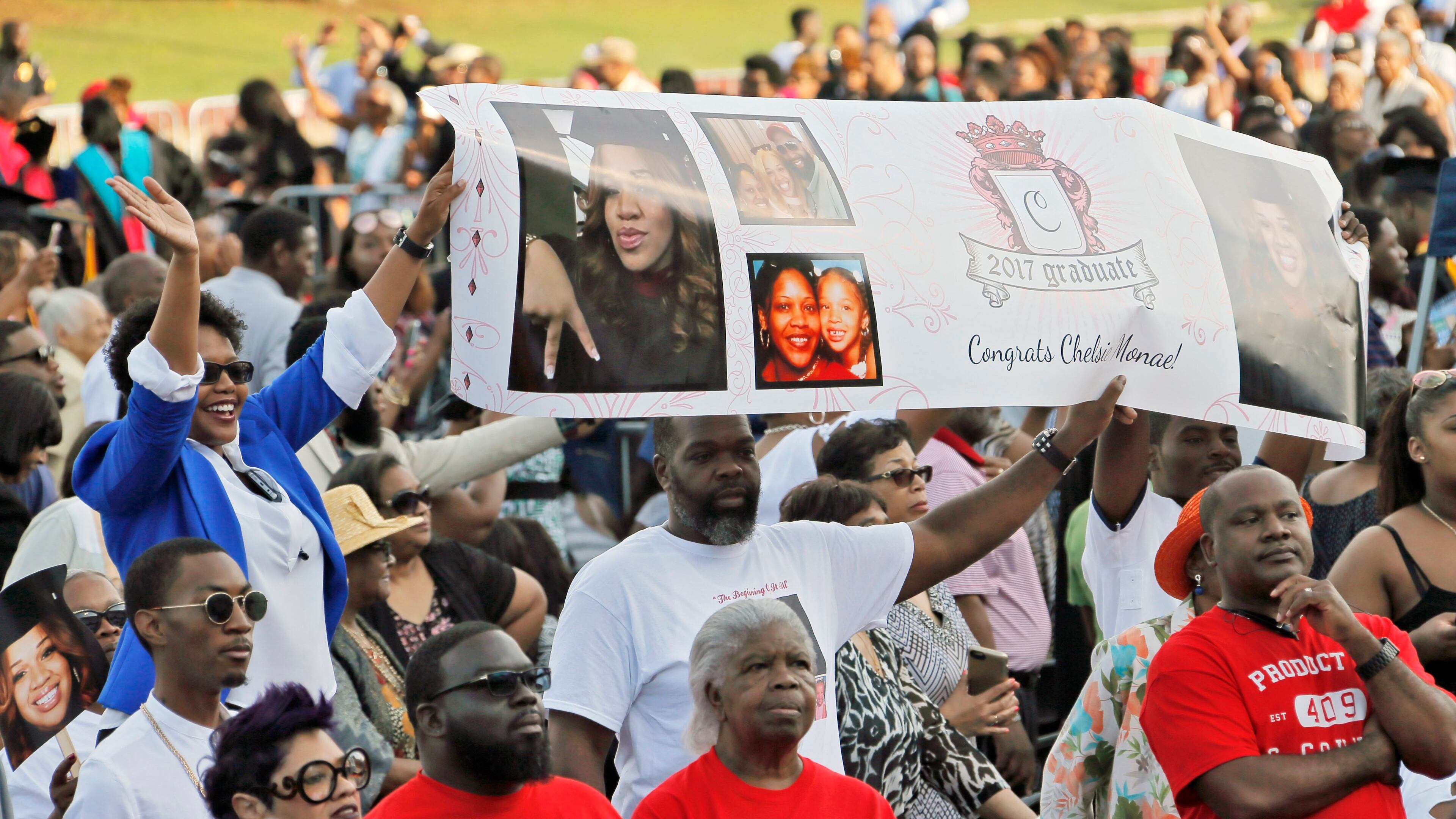 5/22/17 - Atlanta - Family members watch as graduates enter the stadium during the processional. Clark Atlanta University's Panther Stadium was the site of their 28th annual Commencement. Businessman William Pickard gave the commencement address. Rev. Jesse Jackson, who received an honorary degree, also spoke. Panther Stadium, BOB ANDRES /BANDRES@AJC.COM
