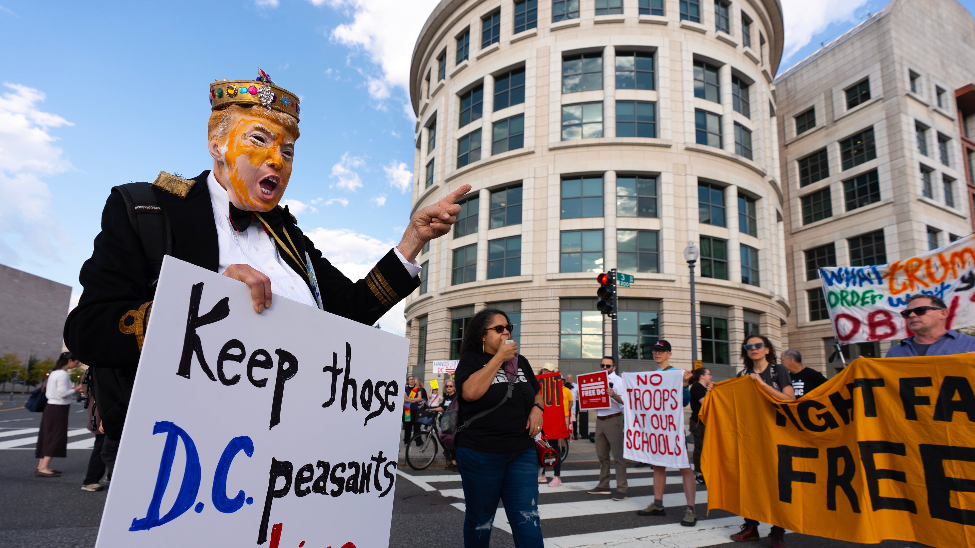 Protestors near the federal courthouse stop traffic and call for the ouster of President Donald Trump's National Guard deployment in Washington, Wednesday, Oct. 14, 2026. (AP Photo/J. Scott Applewhite)