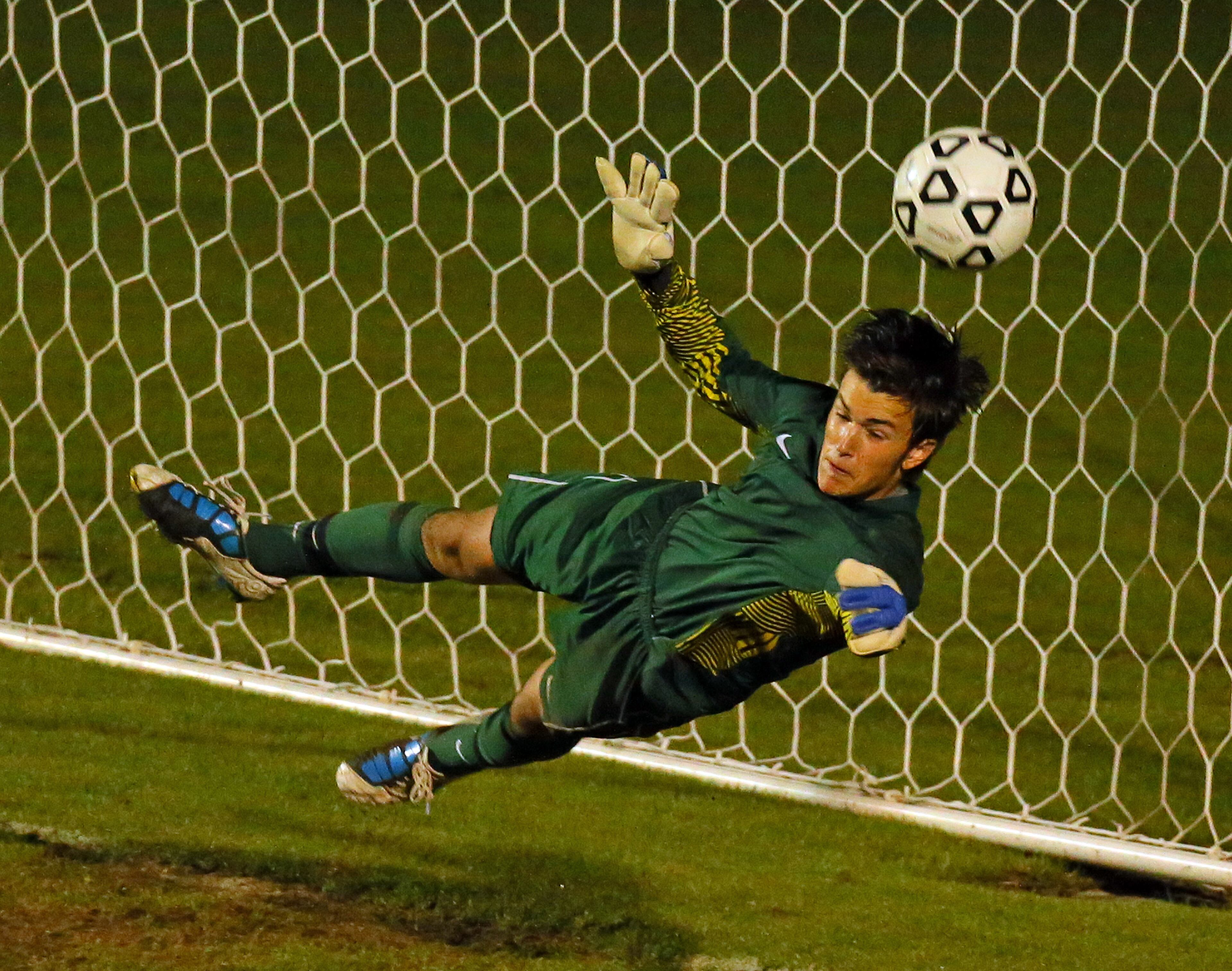 After a scoreless overtime, Westminster freshman goalkeeper Benton Wood blocks this penalty kick to beat Lovett 4-3 on penalty kicks.