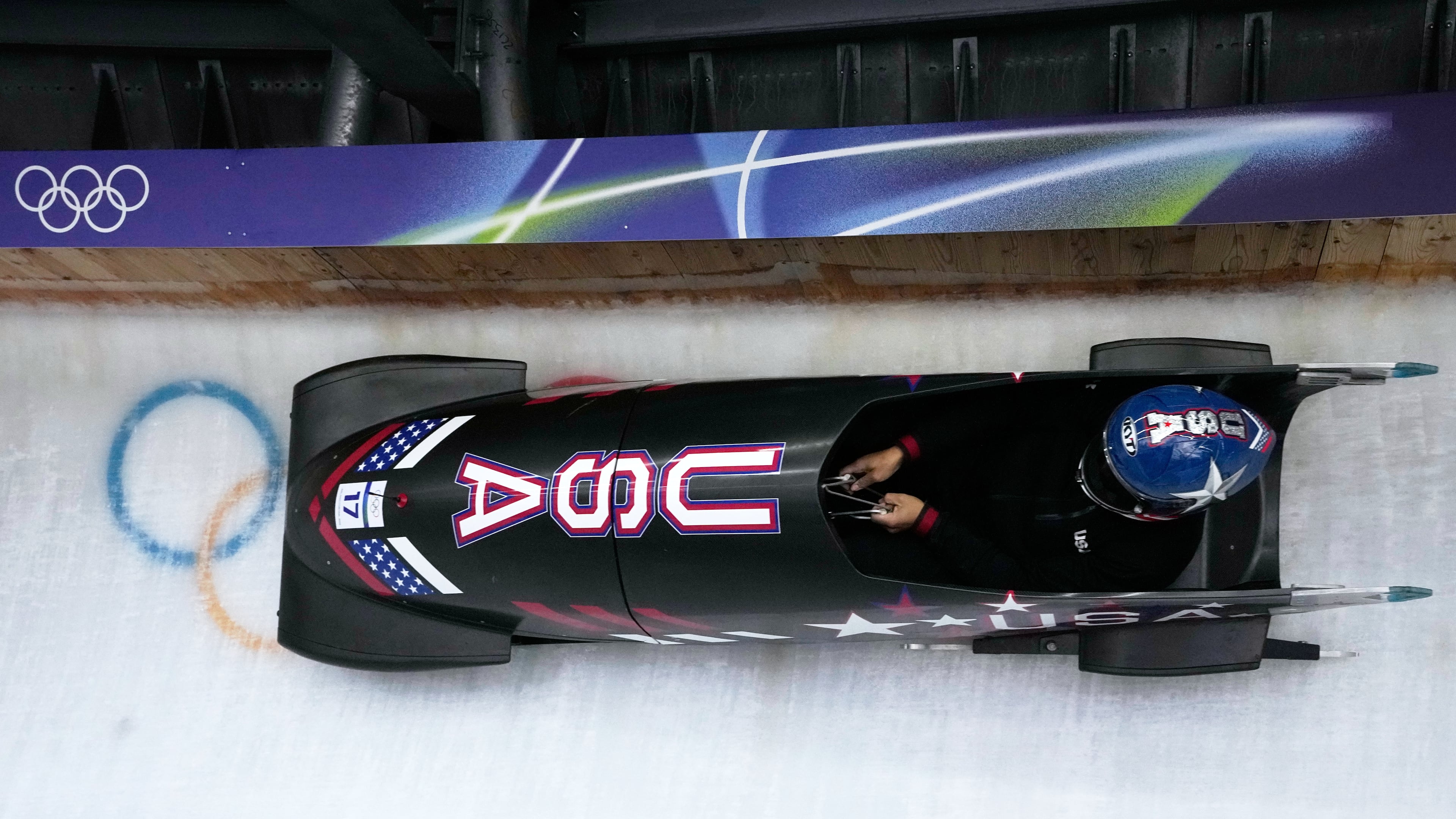 United States' Elana Meyers Taylor slides down the track during a women's monobob training session at the 2026 Winter Olympics, in Cortina d'Ampezzo, Italy, Friday, Feb. 13, 2026. (AP Photo/Aijaz Rahi)