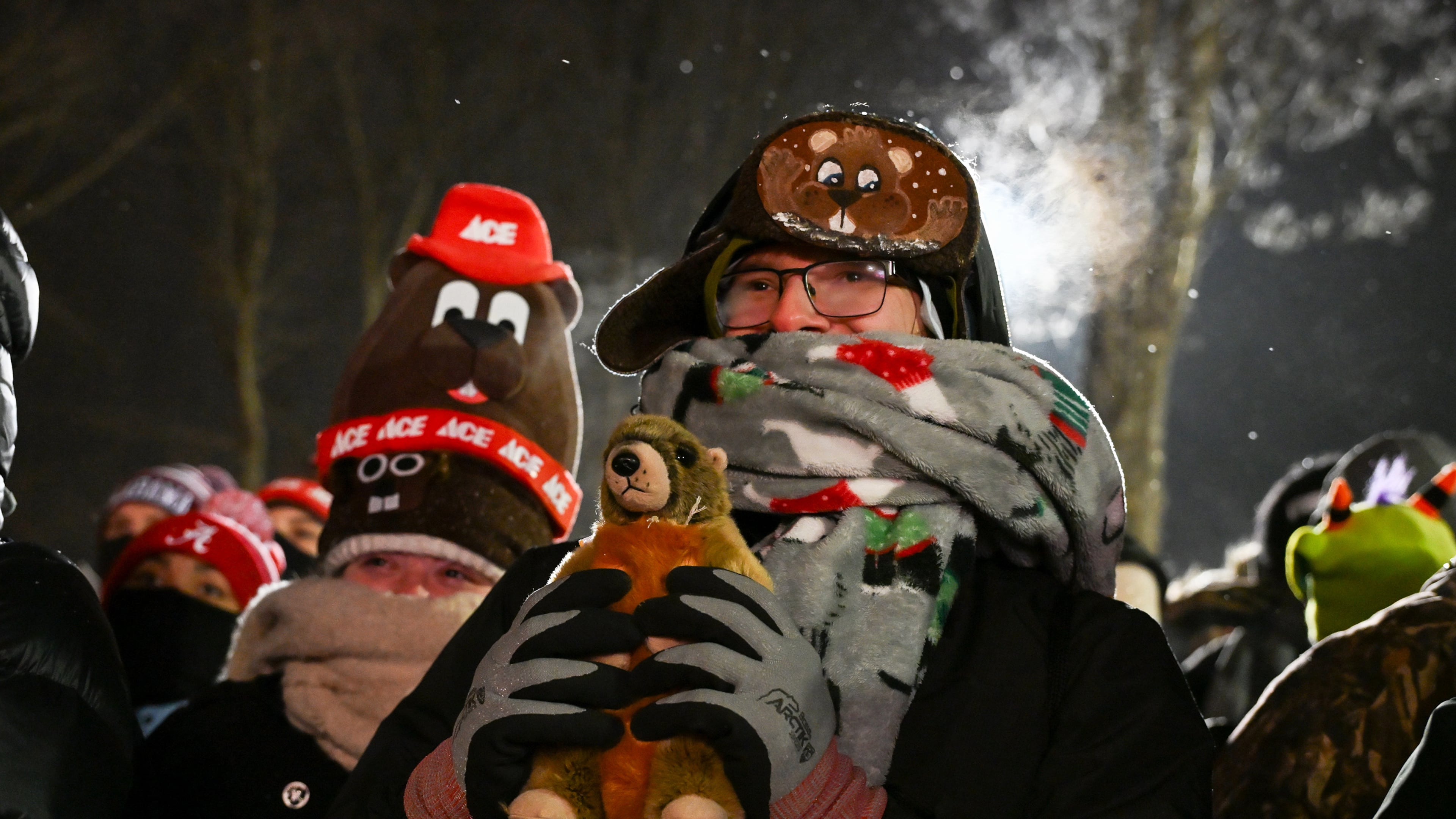 George Morar, of Youngstown, Ohio., celebrates while waiting for Punxsutawney Phil, the weather prognosticating groundhog, to come out and make his prediction during the 140th celebration of Groundhog Day on Gobbler's Knob in Punxsutawney, Pa., Monday, Feb. 2, 2026. (AP Photo/Barry Reeger)