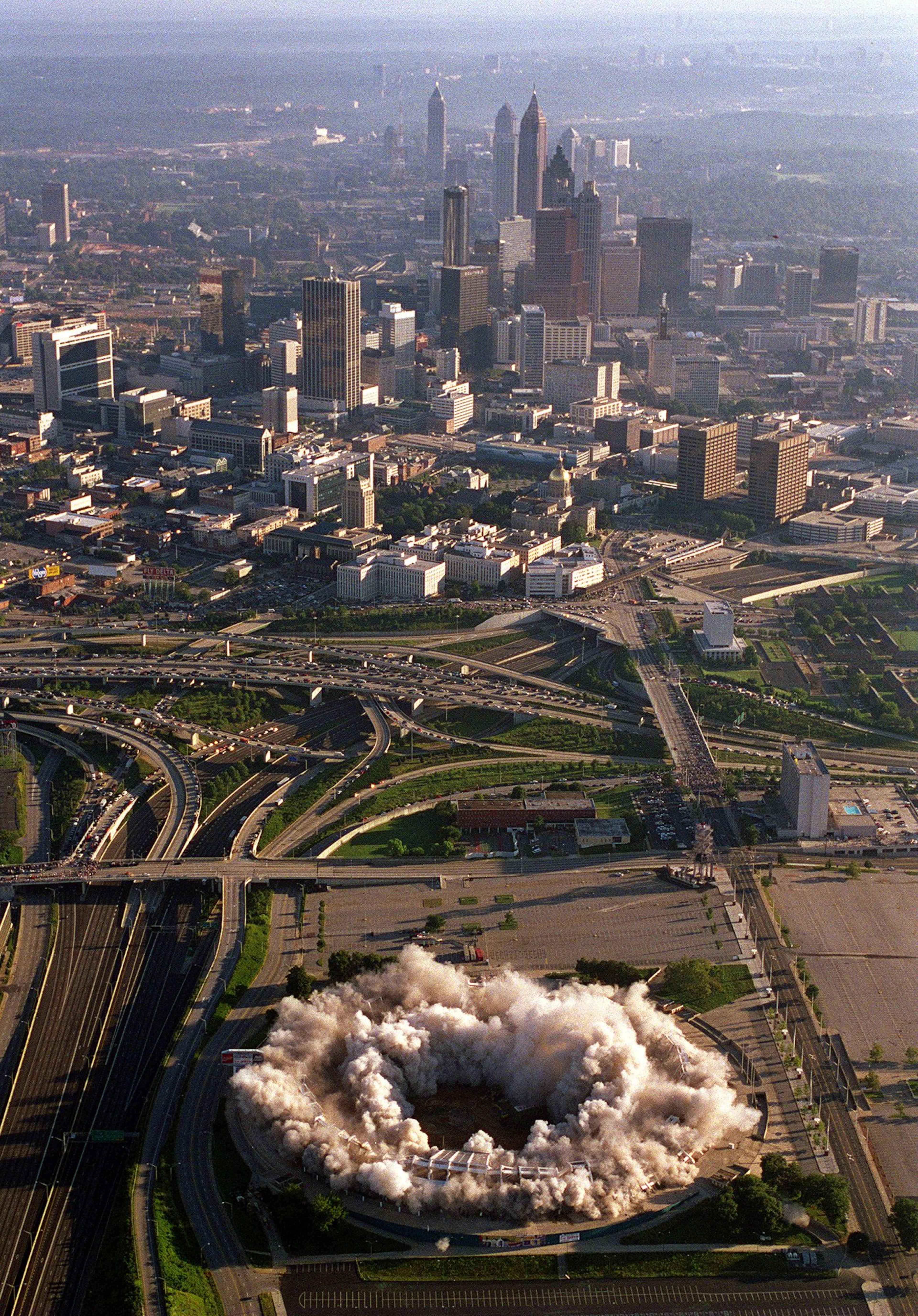 Aerial view of the implosion of Atlanta Fulton County Stadium 8/2/97. The city skyline is in the background. (AJC Staff Photo/Jean Shifrin)
