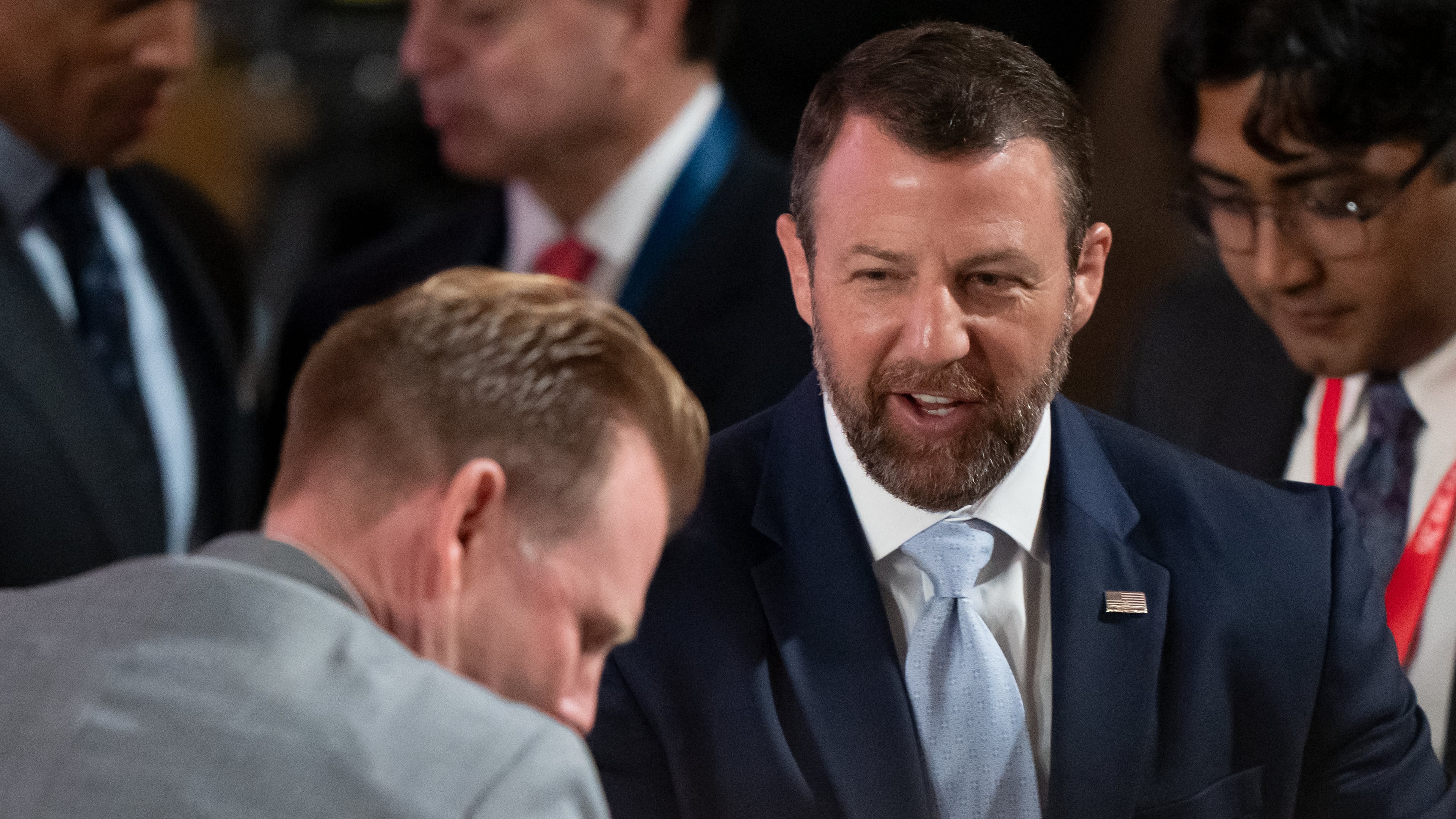 Homeland Security Secretary Markwayne Mullin, right, speaks with Andrew Giuliani before an event to mark the launch of the America.gov website, Tuesday, Sept. 29, 2026, in Washington. (AP Photo/Mark Schiefelbein)