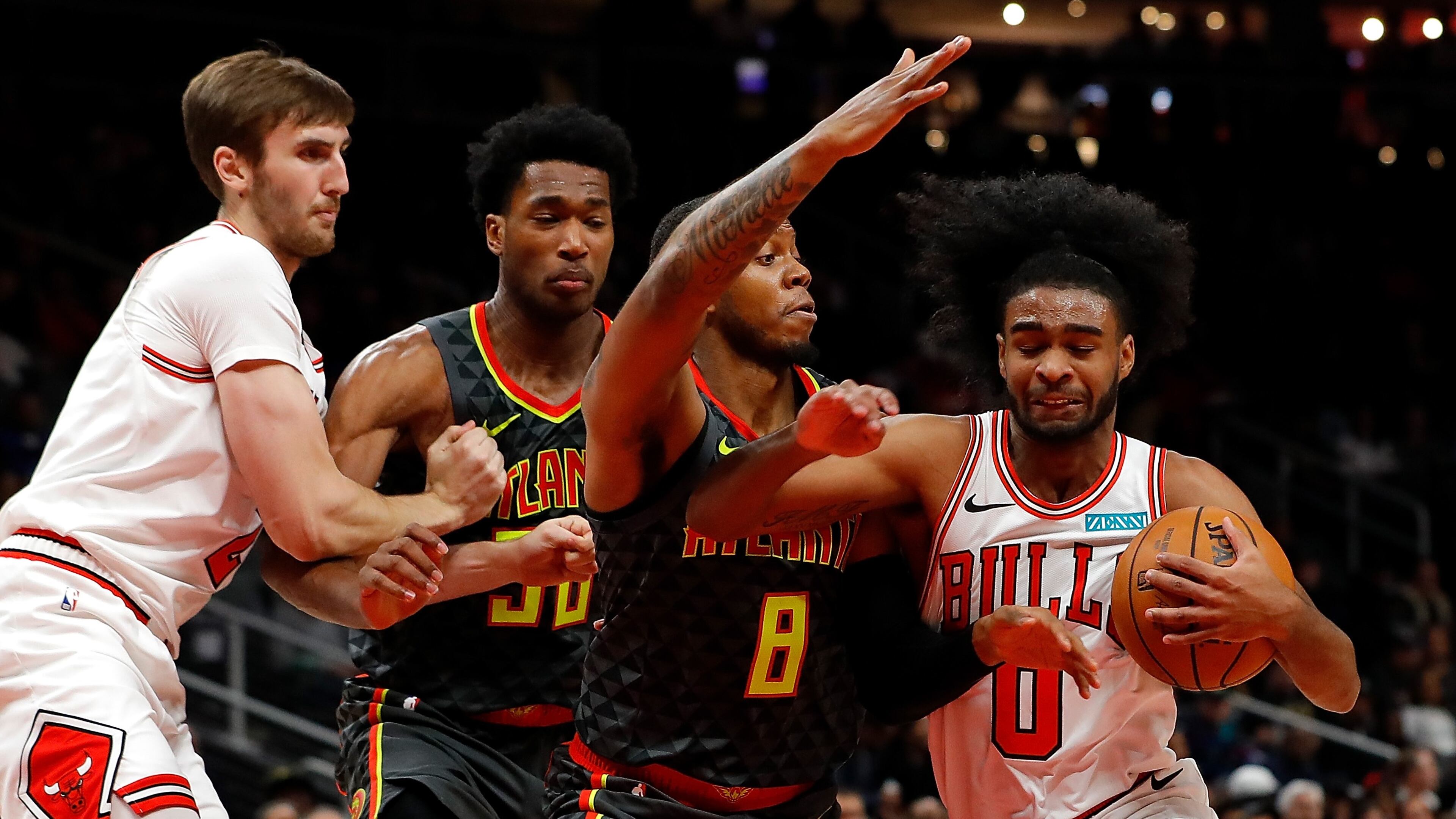 Coby White of the Chicago Bulls drives against Tyrone Wallace (8) of the Atlanta Hawks in the second half at State Farm Arena on November 06, 2019 in Atlanta, Georgia.