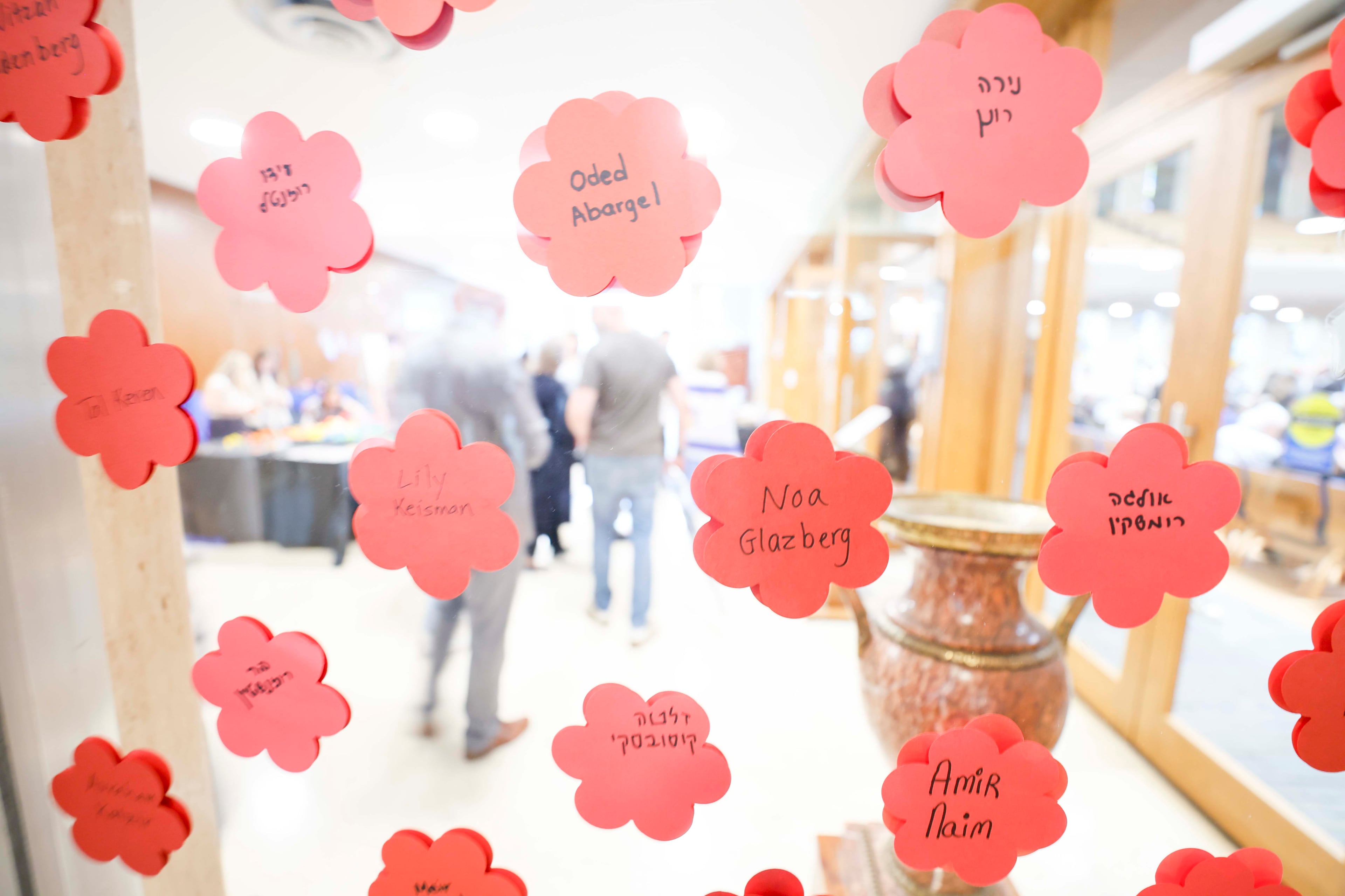 Names of victims are displayed inside the Ahavath Achim Synagogue as members of the Jewish community gather on Sunday, Oct. 5, 2025, to mark the second anniversary of the Oct. 7 attacks. (Miguel Martinez/AJC)
