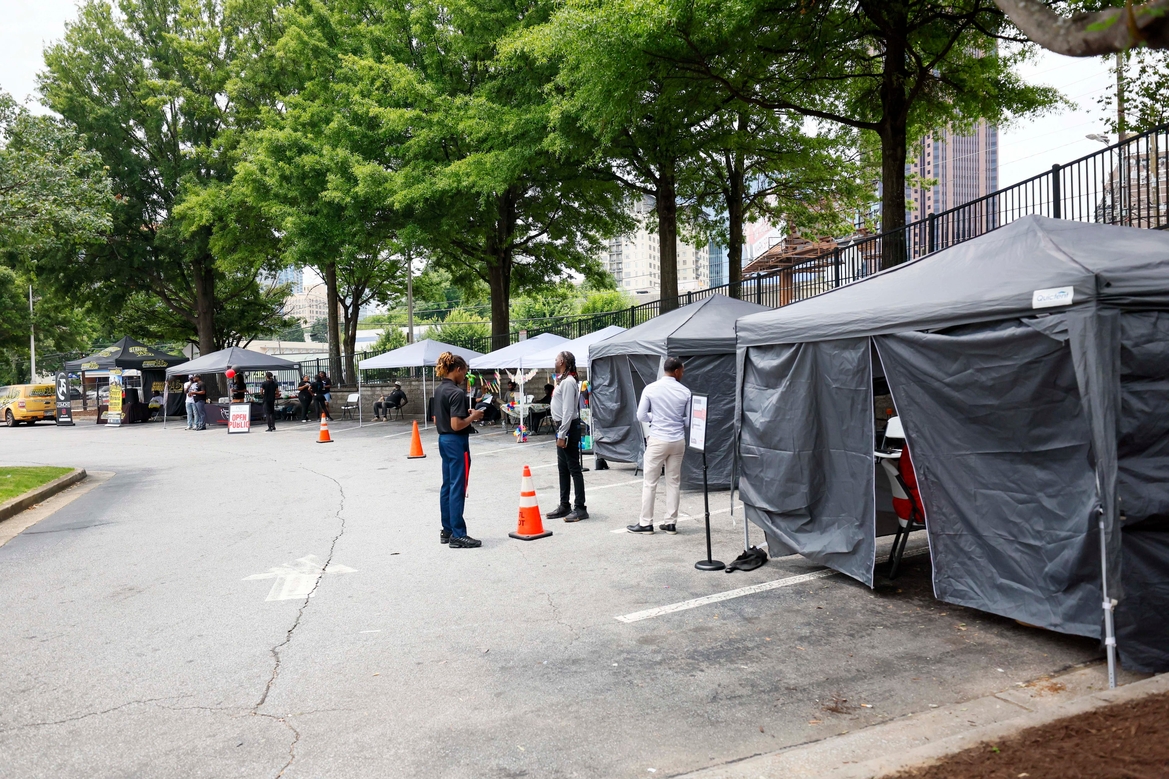 Staff from the Empowerment Resource Center, in collaboration with Walgreens and Streetz 94.5, participate in an HIV testing event on Wednesday, June 25, 2025, as funding changes have impacted metro Atlanta organizations and communities. (Miguel Martinez/AJC)