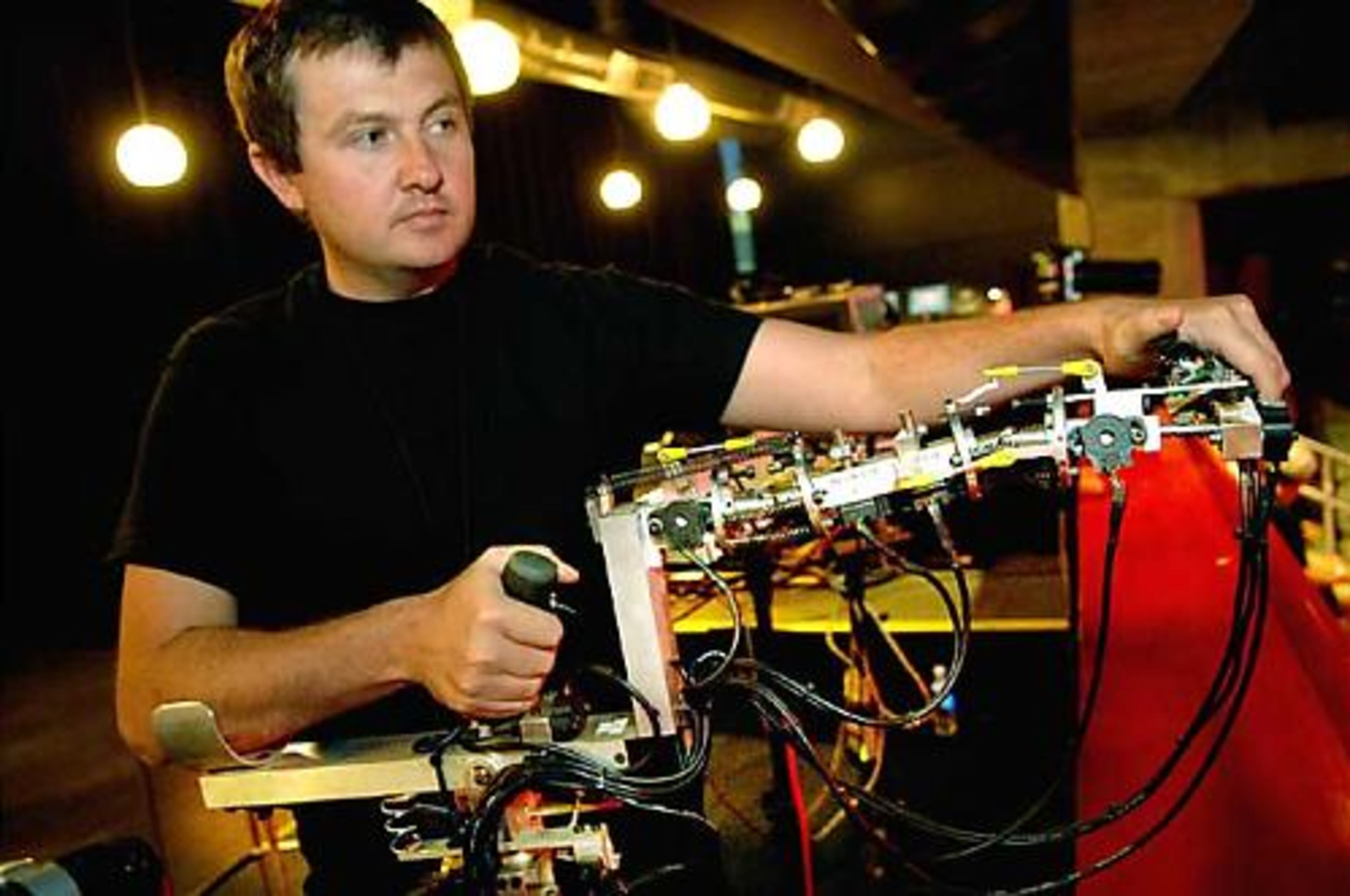 Head of puppetry, Matthew McCoy, demonstrates a 'voodoo rig' of miniature versions of the dinosaurs with the same joints and range of movement as their life-sized counterparts. The voodoo rig actions are interpreted by computer and transmitted by radio waves to make the big dinosaurs move.
