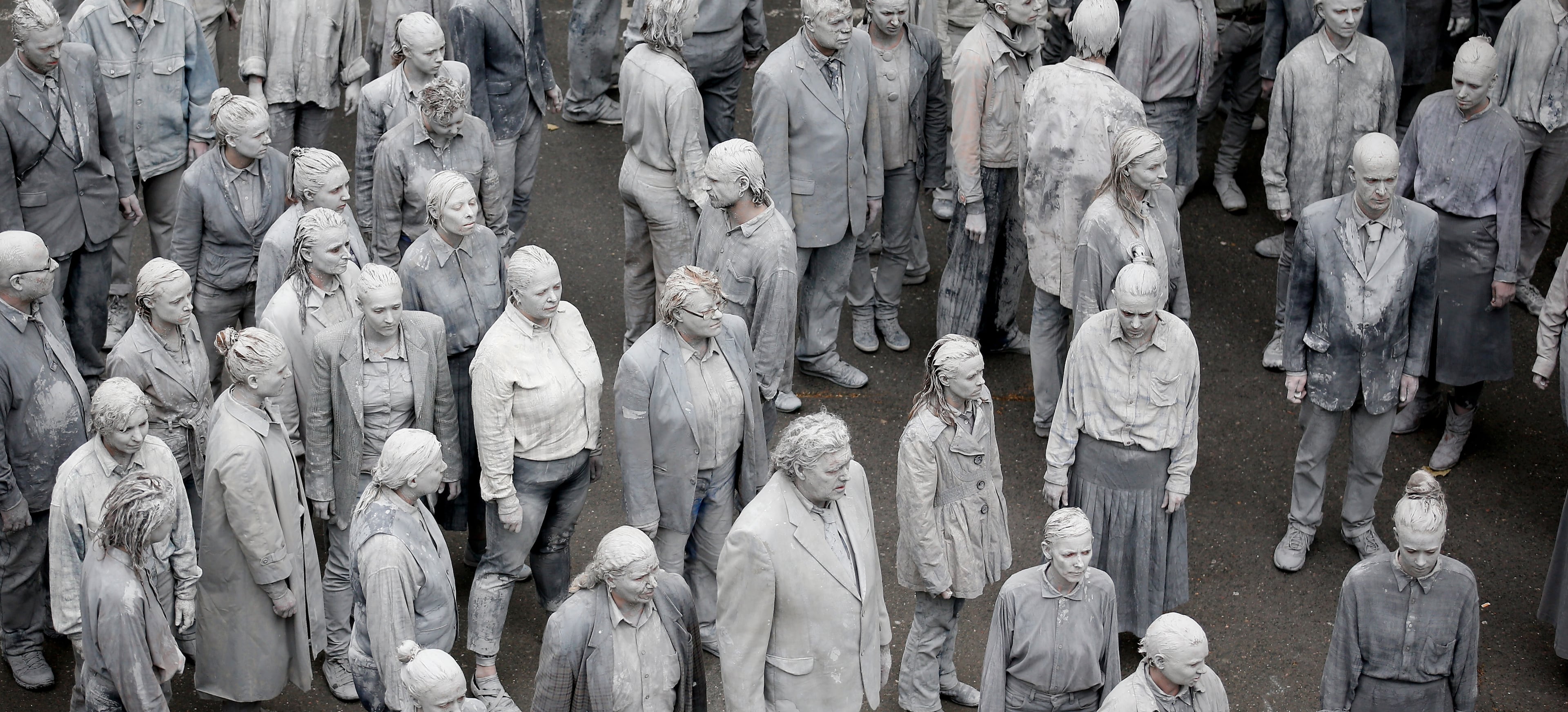 HAMBURG, GERMANY - JULY 05: Prostestors dressed-up in grey clothes like Zombies attend an arts performance called '1000 Gestalten' demonstration prior the upcoming G20 summit on July 5, 2017 in Hamburg, northern Germany. In a two-hour show hundreds of actors took part in a creative public appeal for more humanity and self-responsibility ahead of the upcoming G20 summit. The G20 economic summit takes place in Hamburg July 7-8. (Photo by Friedemann Vogel-Pool/Getty Images)