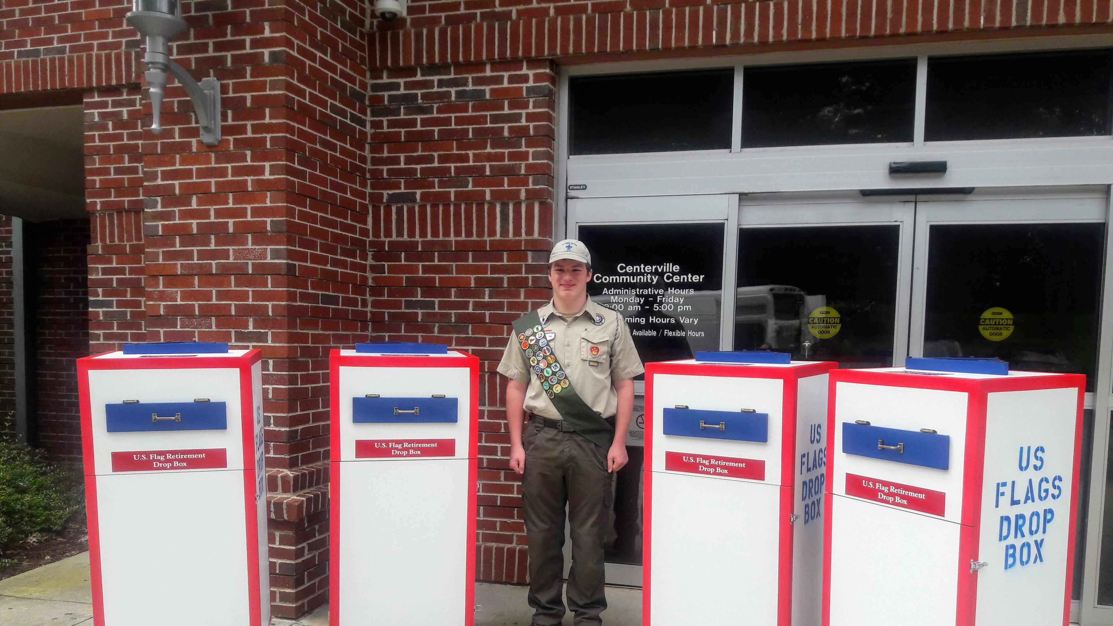 Boy Scout Ayden Abercrombie with the his Eagle project that produced four flag drop boxes to collect worn and tattered American flags. Courtesy Dean and Lisa Abercrombie
