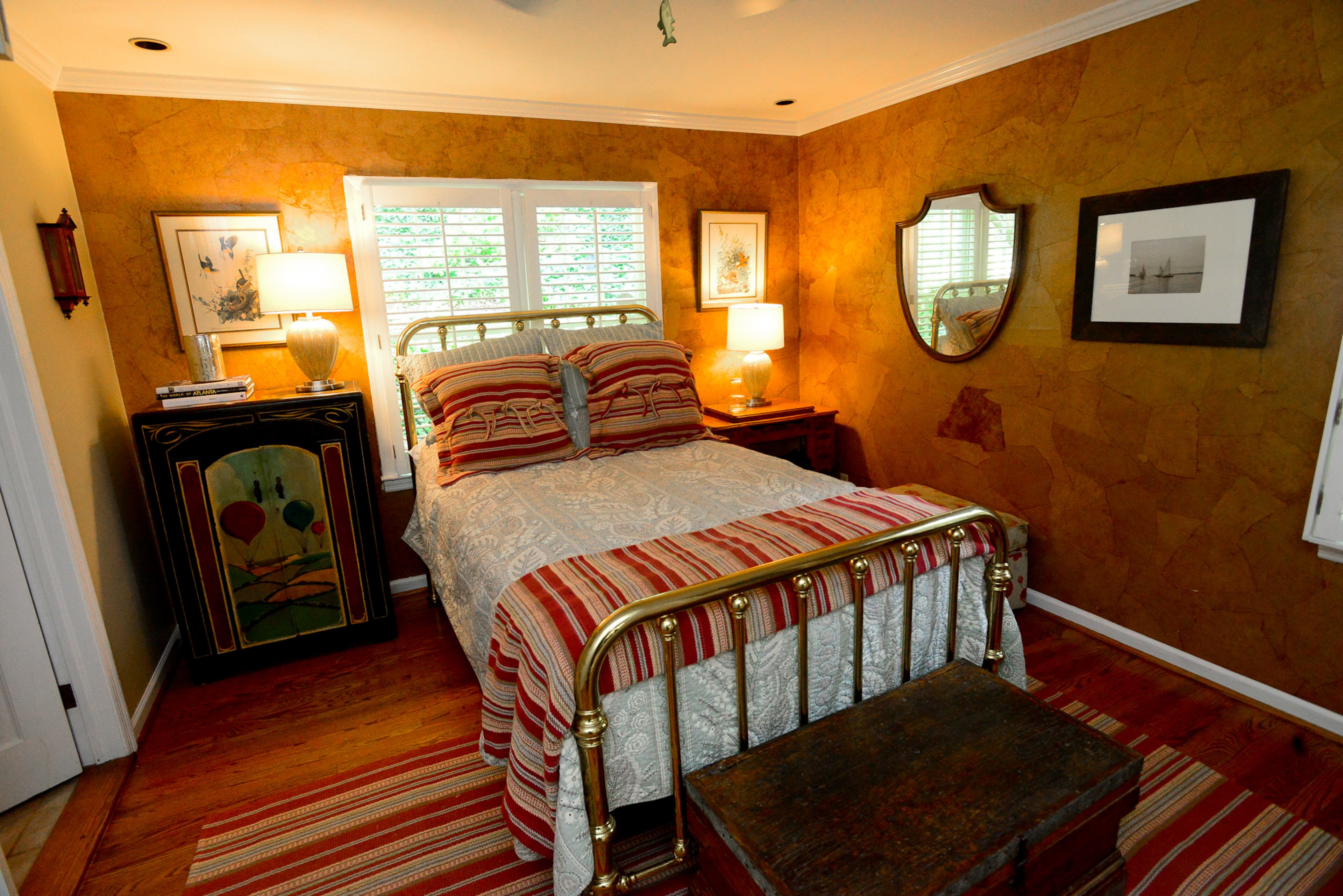The home's handcrafted elements extend beyond carpentry. The Lewis children worked on the walls in one room, by tearing up brown paper into small pieces, wadding them up, dunking in polyurethane and applying to the wall. The brass bed was purchased in upstate New York in 1978.