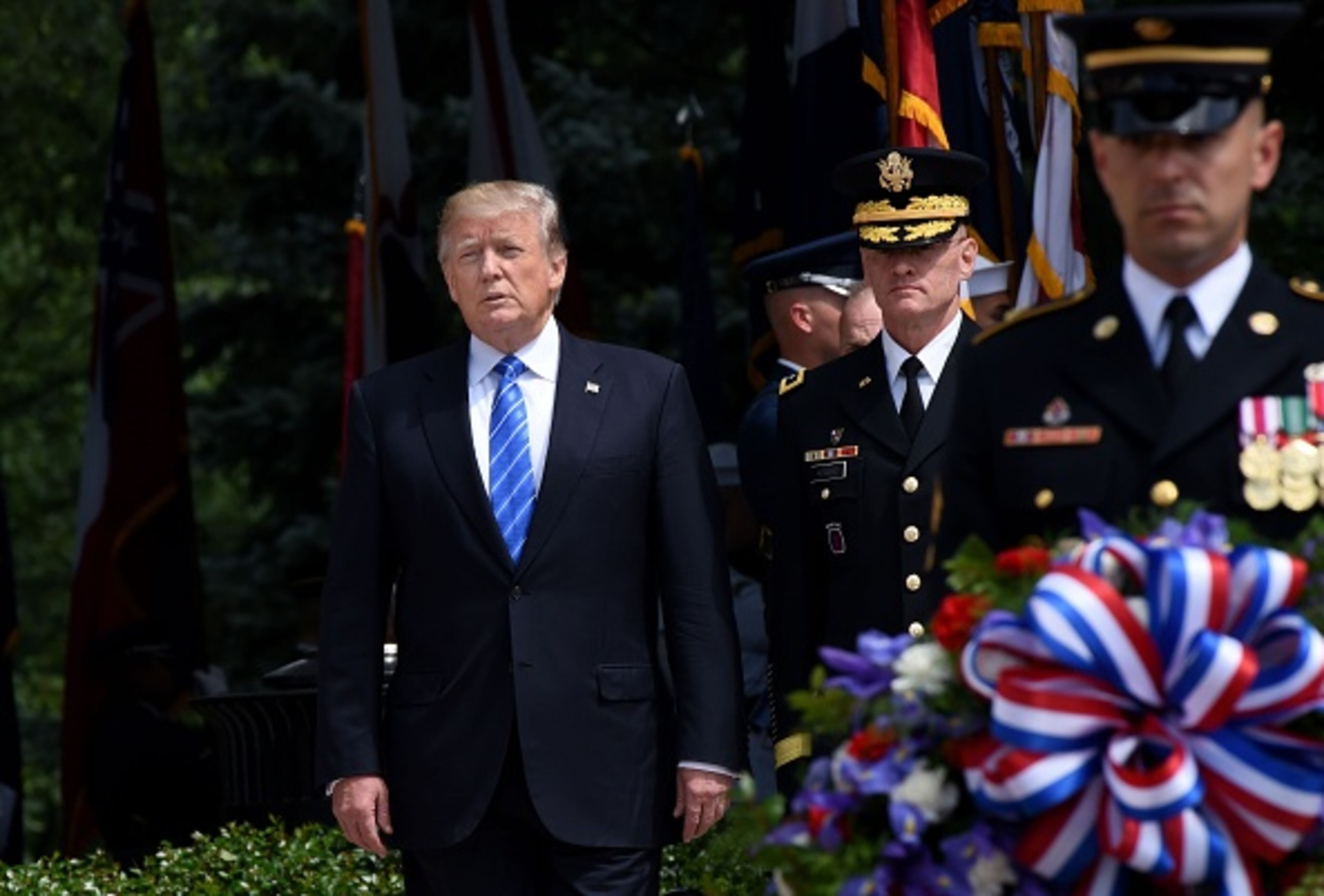 ARLINGTON, VA - MAY 29: President Donald Trump participates in a wreath-laying ceremony at the Tomb of the Unknown Soldier at Arlington National Cemetery on Memorial Day, May 29, 2017 in Arlington, Virginia. (Photo by Olivier Douliery - Pool/Getty Images)