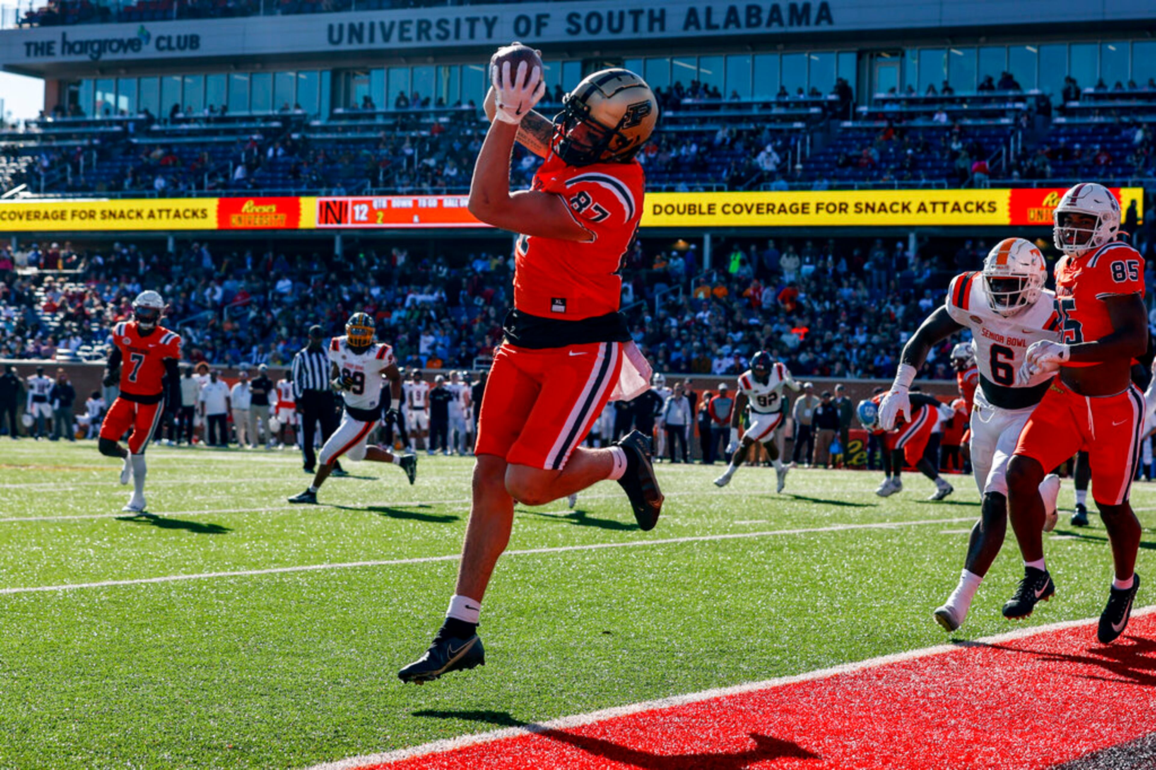 National tight end Payne Durham of Purdue (87) catches a pass for a two-point conversion against the American team during the first half of the Senior Bowl NCAA college football game, Saturday, Feb. 4, 2023, in Mobile, Ala.. (AP Photo/Butch Dill)