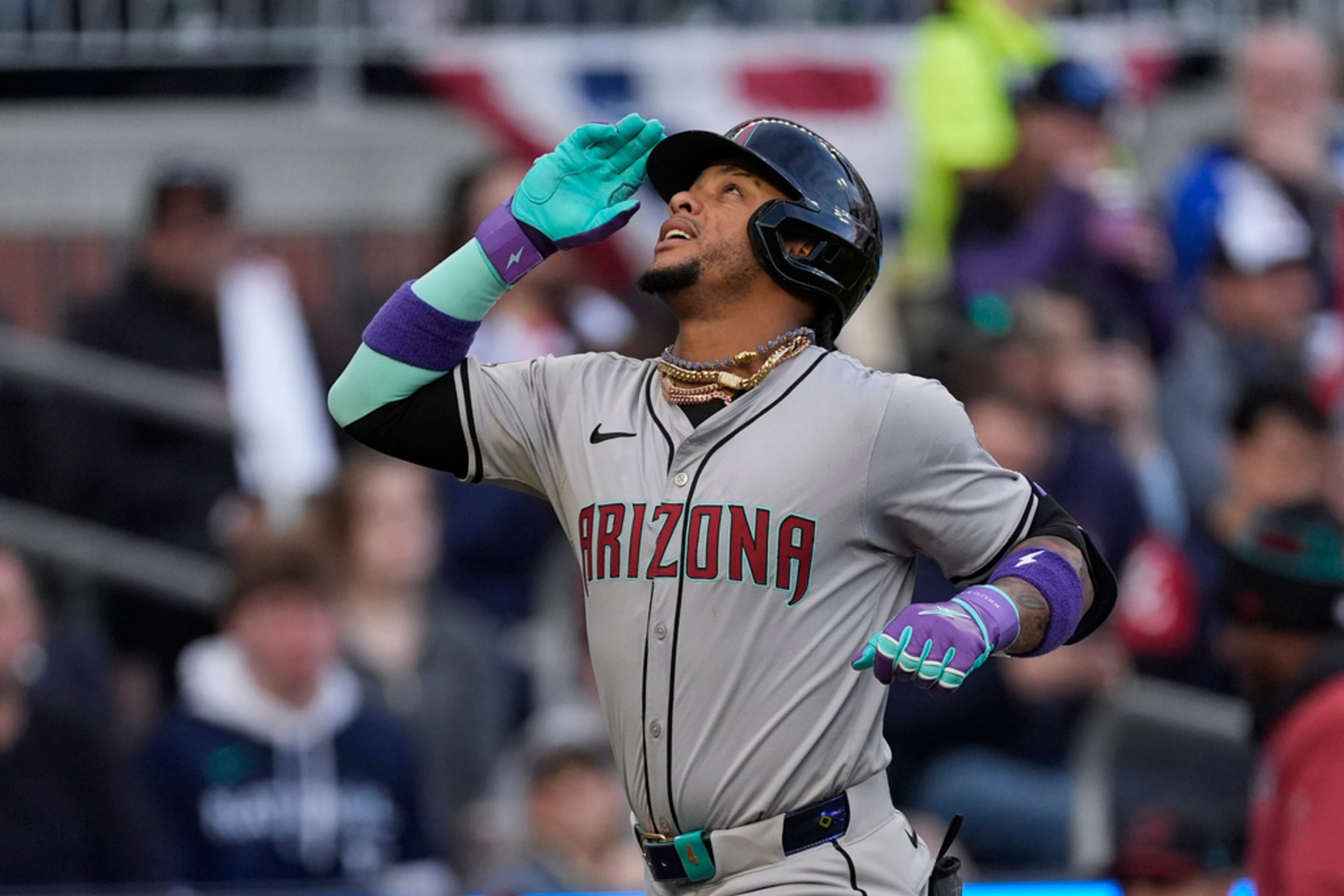 Arizona Diamondbacks' Ketel Marte gestures as he rounds the bases after hitting a solo home run in the fiorst inning of baseball game against the Atlanta Braves Saturday, April 6, 2024, in Atlanta. (AP Photo/John Bazemore)