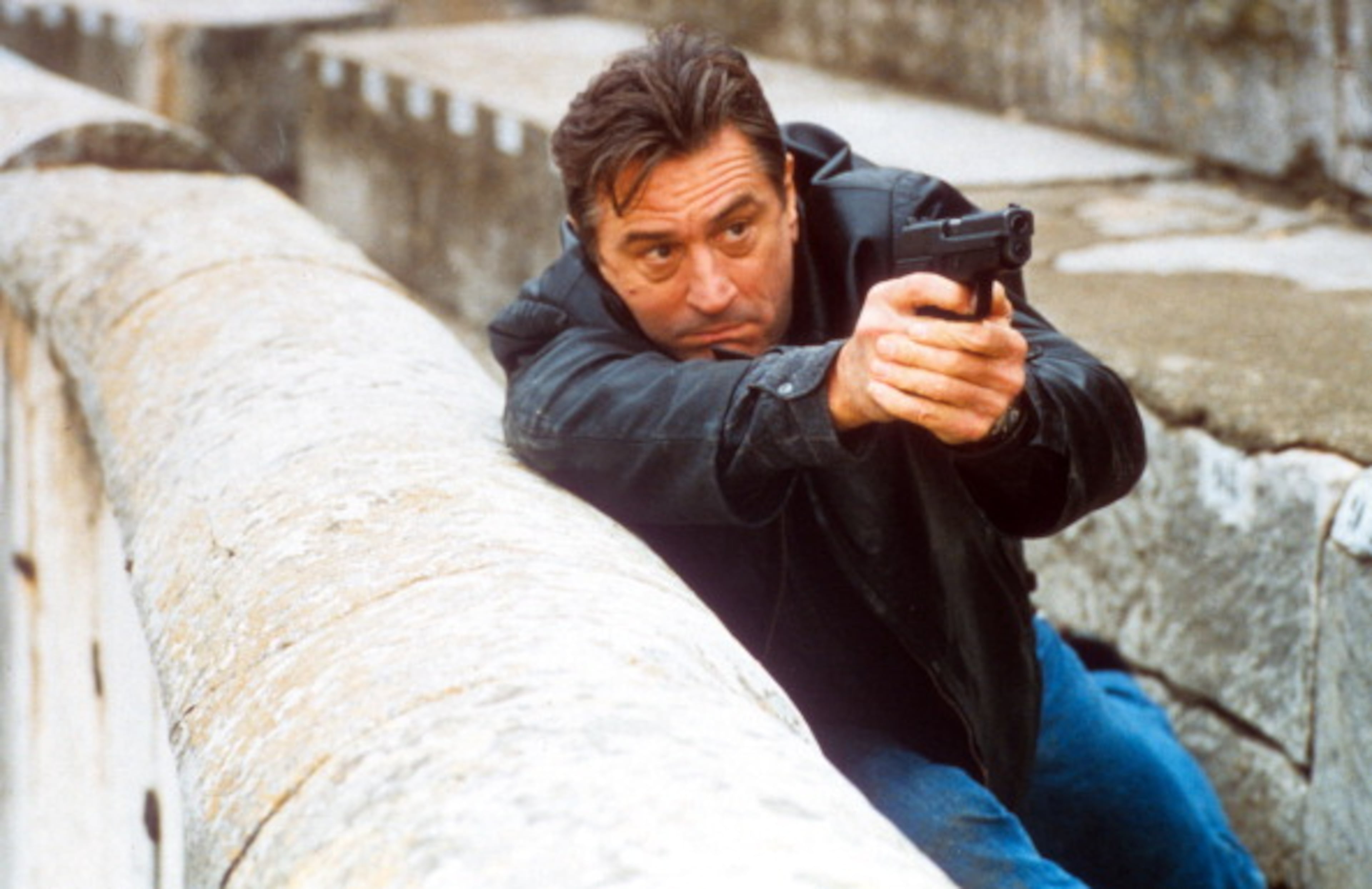 Robert De Niro aiming gun in a scene from the film 'Ronin', 1998. (Photo by United Artists/Getty Images)