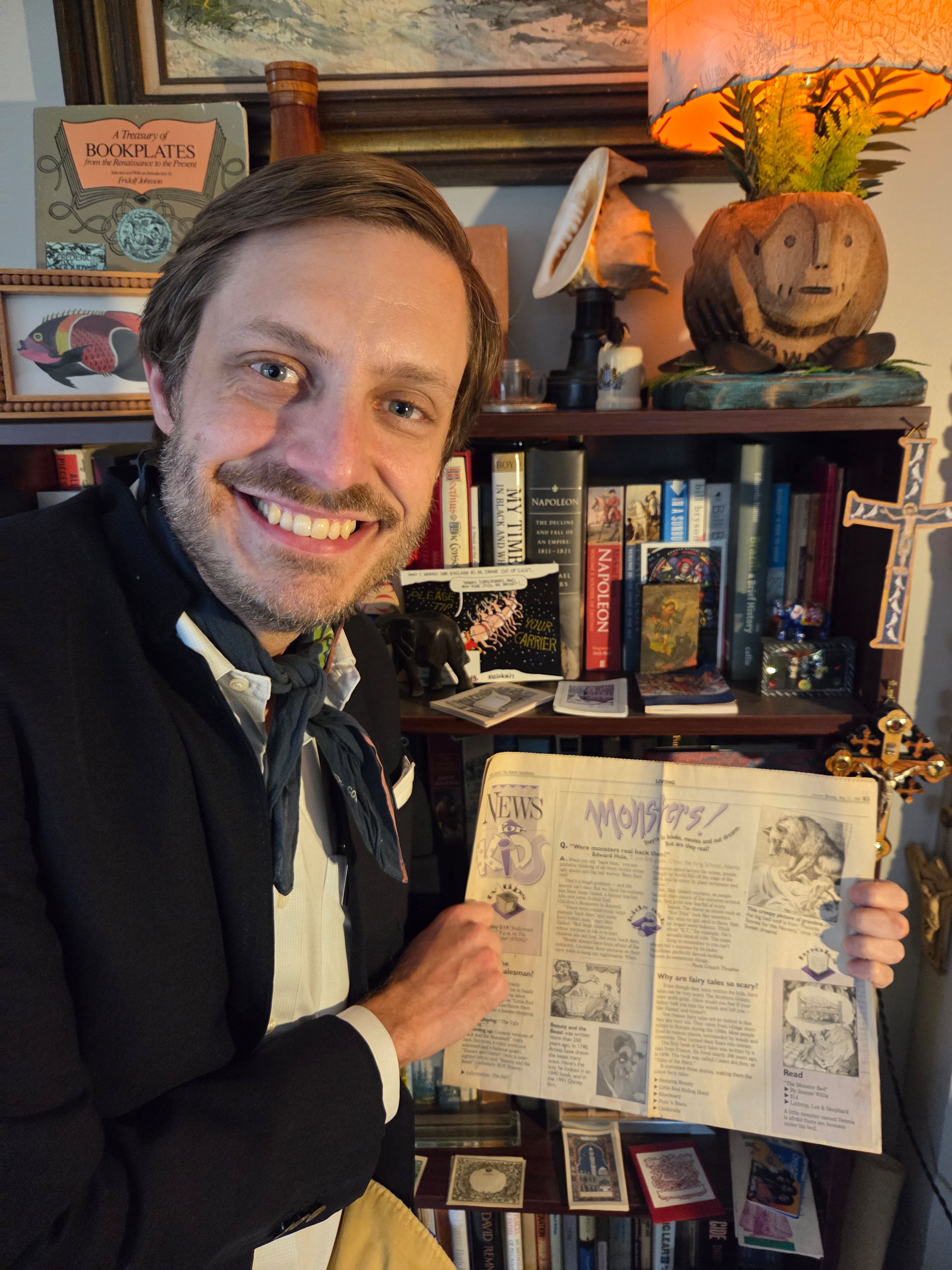 Ed Hula holds the "News for Kids" article that featured his write-in question in the May 17, 1993, edition of the newspaper. (Courtesy)