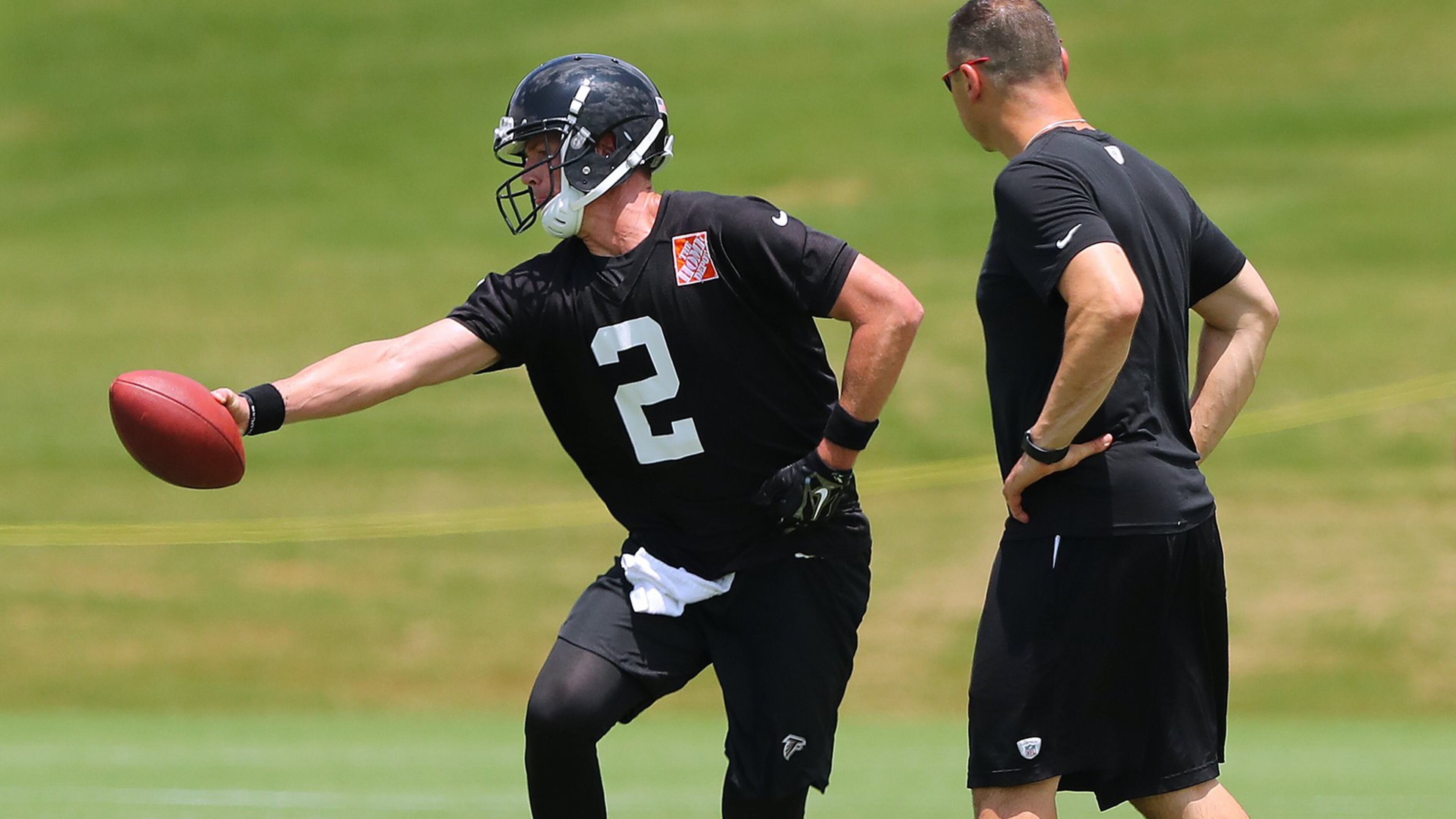 Falcons new offensive coordinator Steve Sarkisian watches quarterback Matt Ryan’s technique during the first day of mini-camp on Tuesday, June 13, 2017, in Flowery Branch. Curtis Compton/ccompton@ajc.com