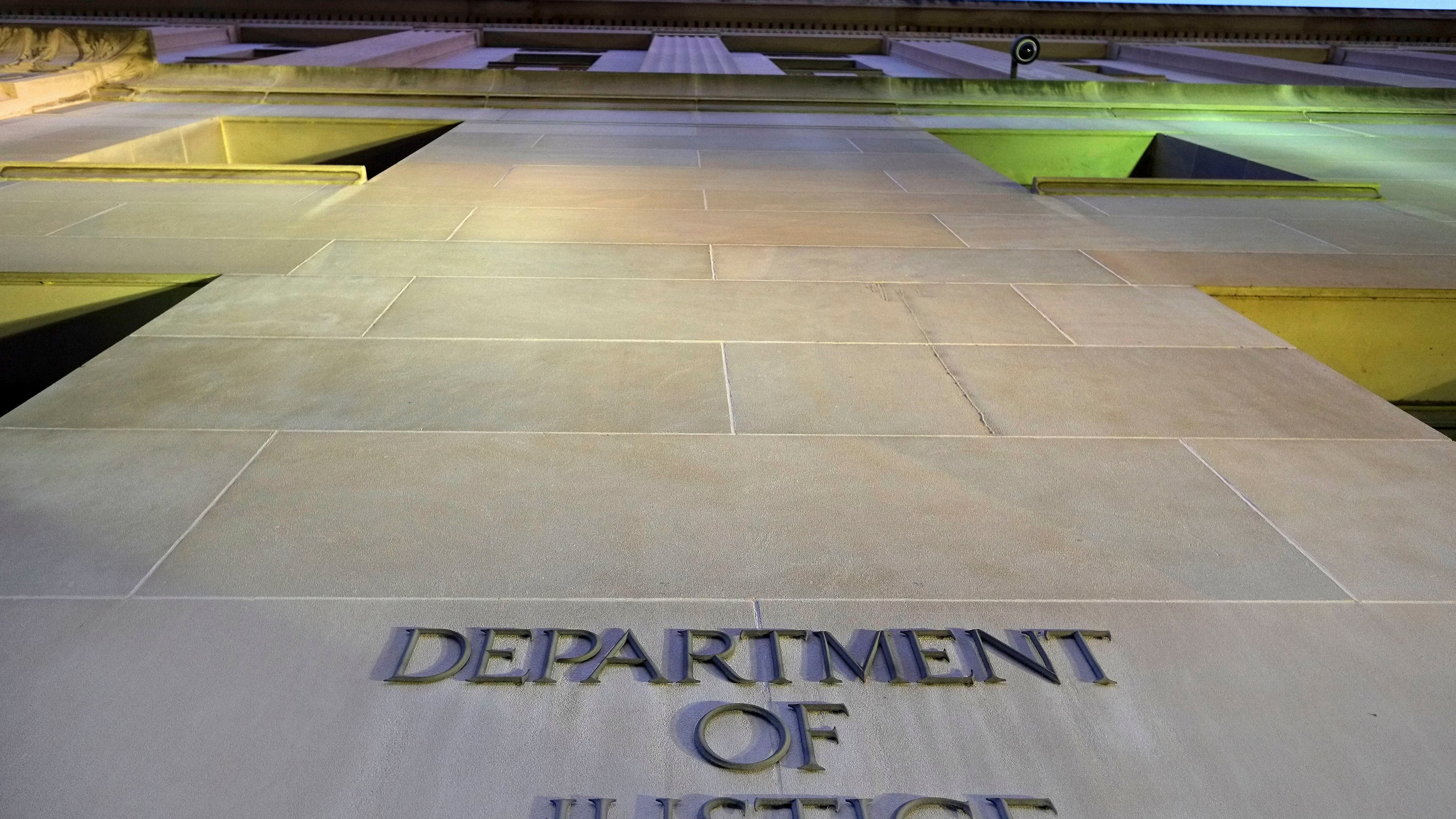 FILE - Tthe Department of Justice headquarters building in Washington is photographed early in the morning, May 14, 2013. (AP Photo/J. David Ake, File)