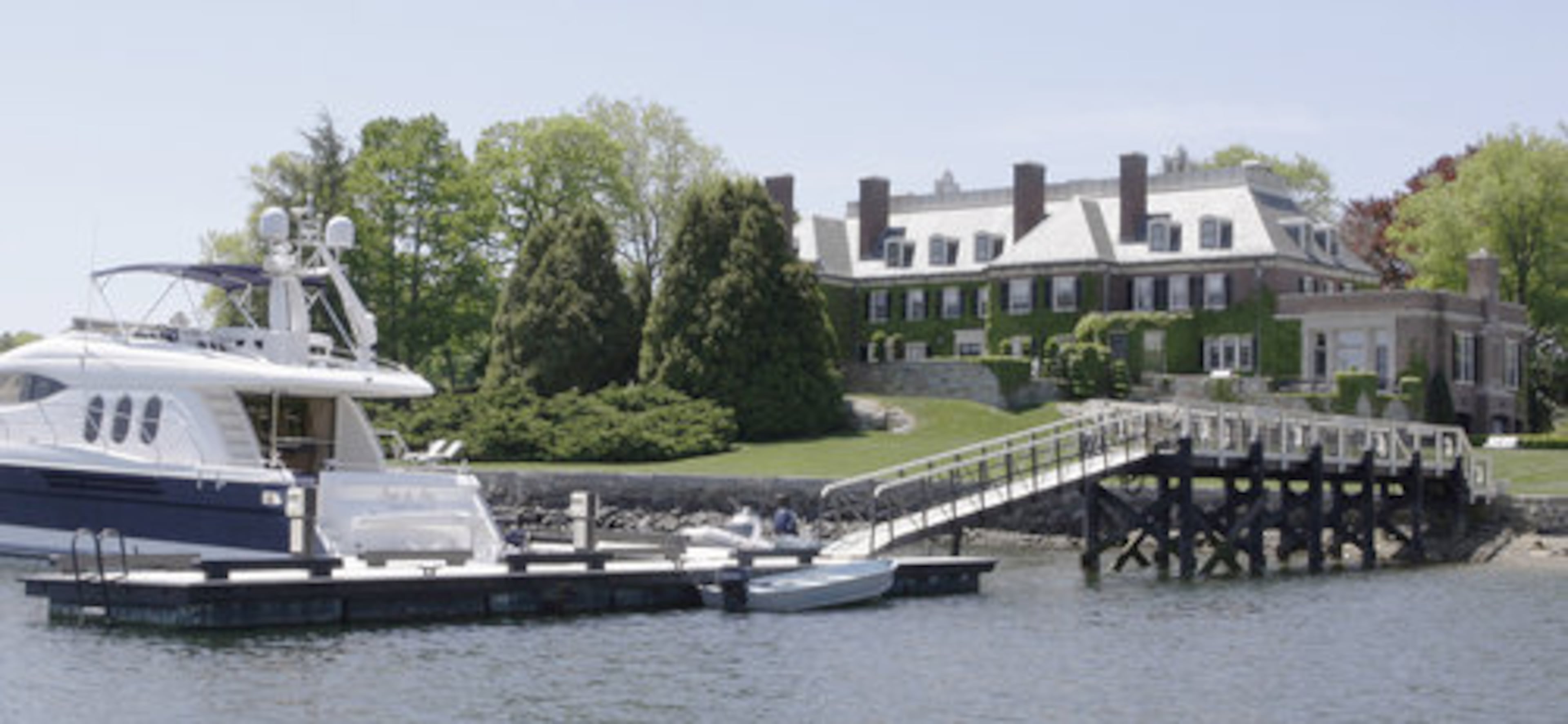 The back side of the historic mansion known as The Oaks features a private pier.