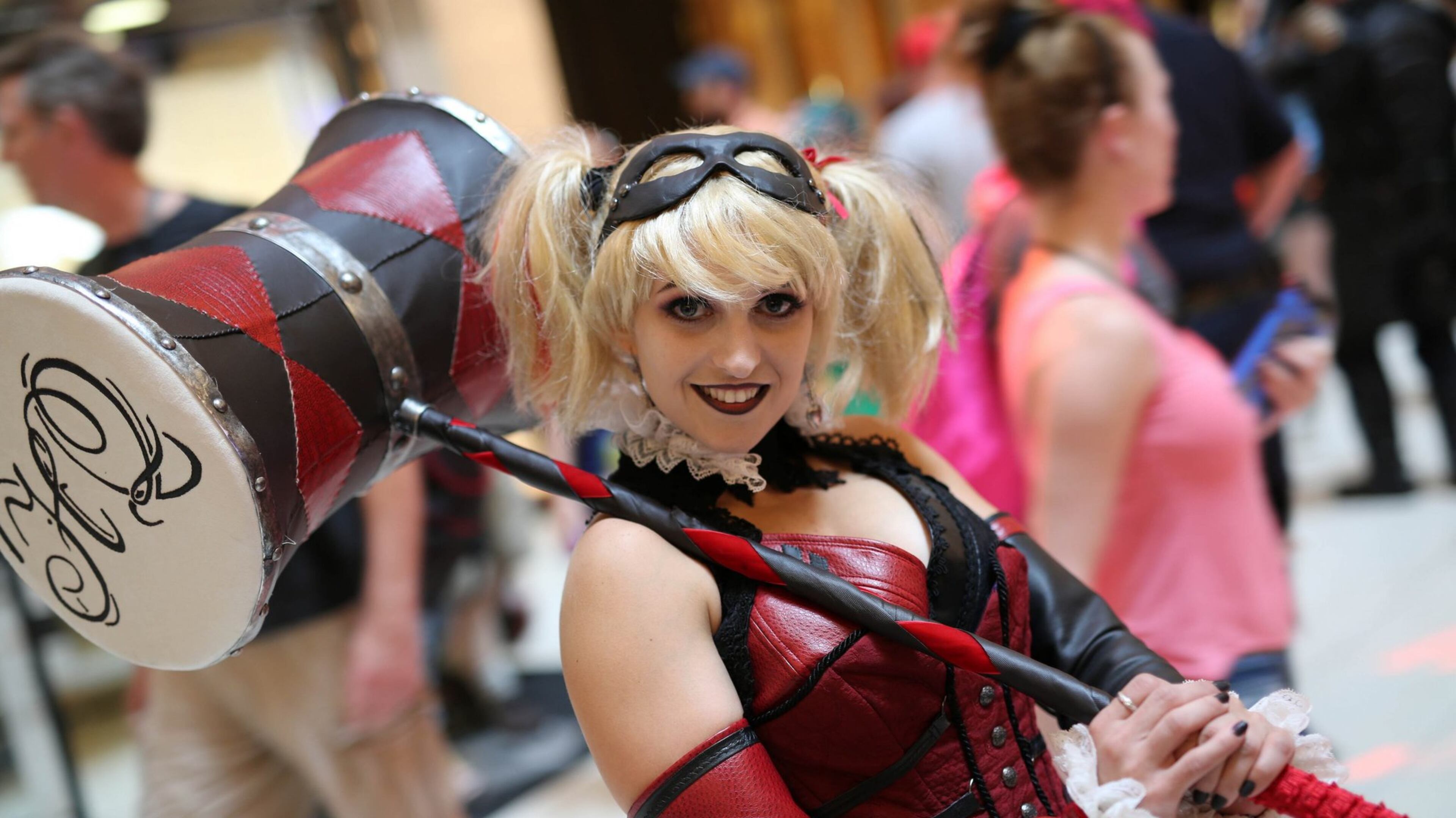 A cosplay fan dressed as Harley Quinn from Batman joins the Dragon Con parade in 2016.
