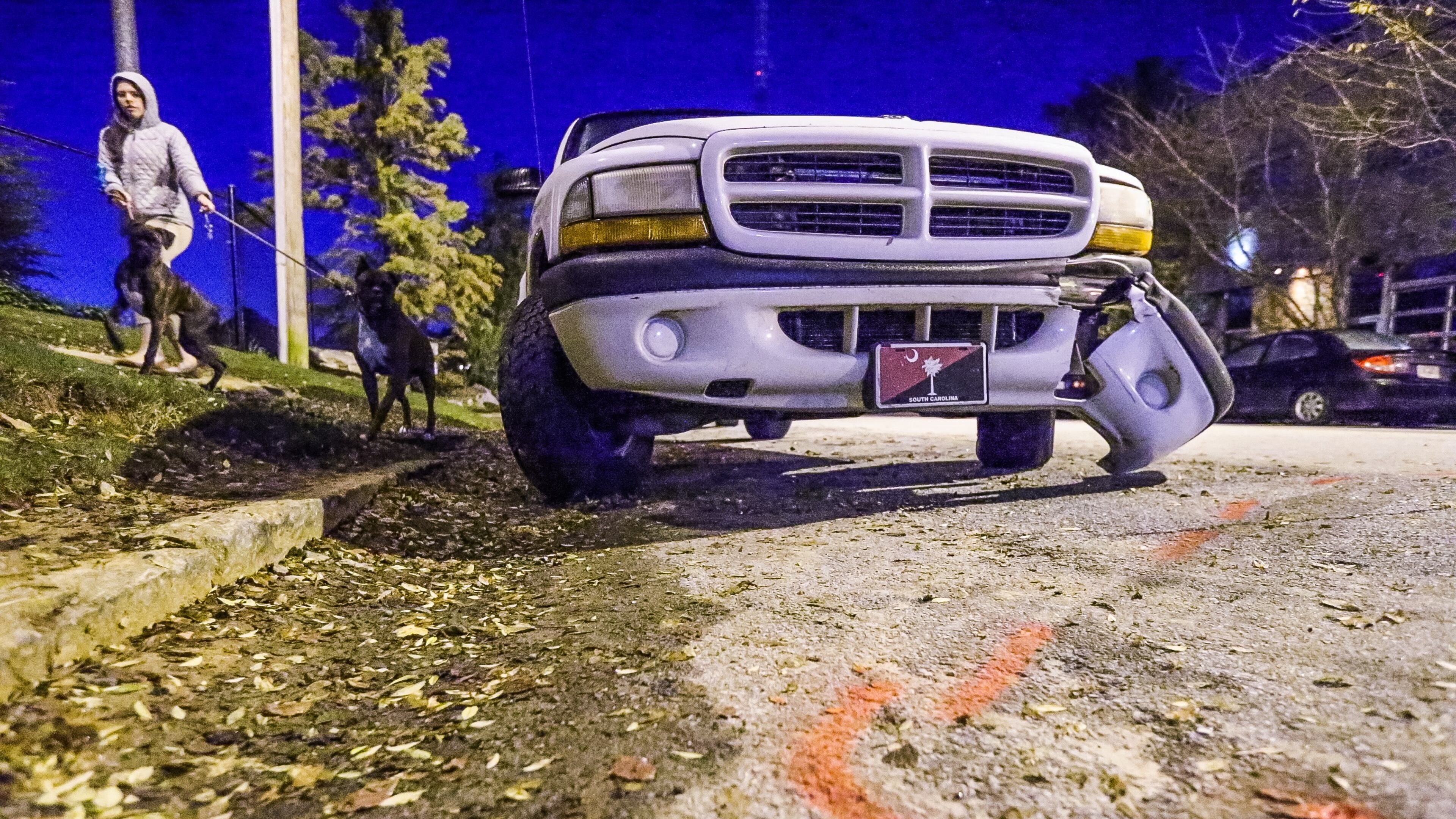 A woman died after being run over by a vehicle that also hit this SUV parked along Arizona Avenue in northeast Atlanta on Nov. 11, 2015.