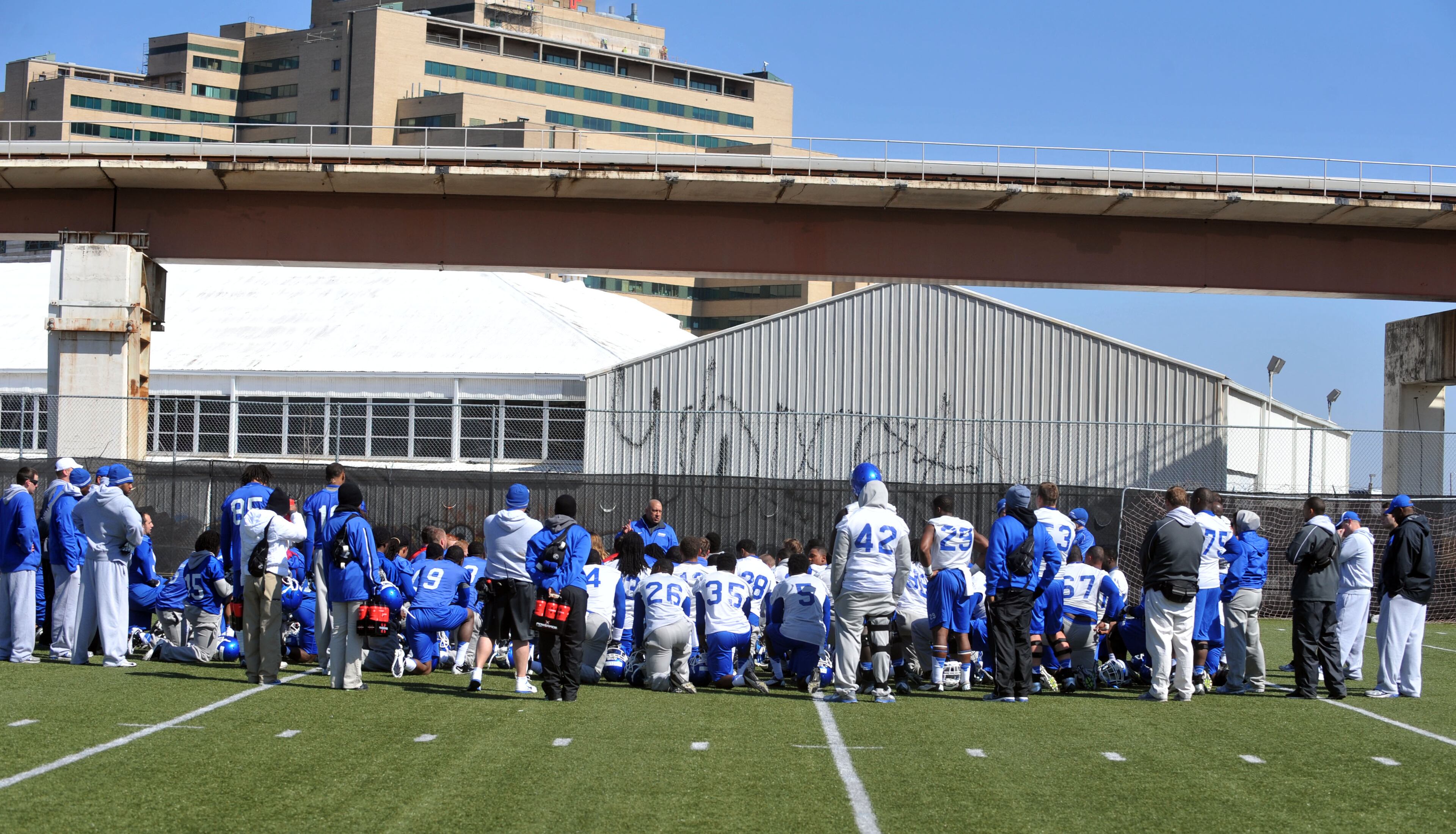 Coach Miles talks to the team following the completion of Weds practice session. Georgia State opened its first spring practice under new head coach Trent Miles at the GSU Practice Complex in downtown Atlanta Wednesday, March 27, 2013.
