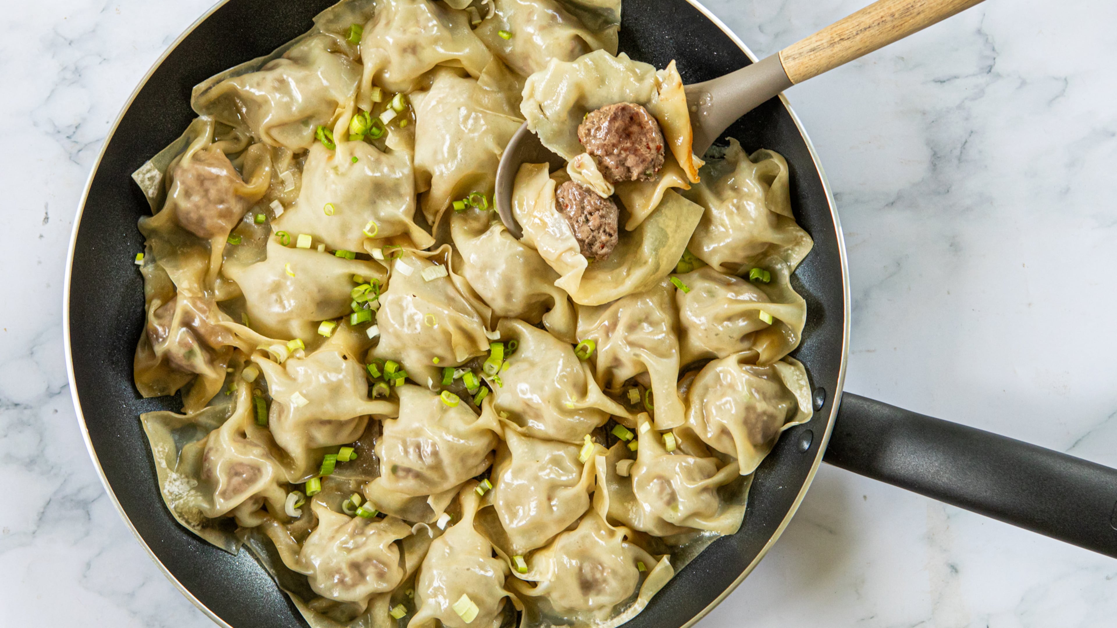 Blanket dumplings are what they sound like: a ball of filling blanketed, rather than encased, in a wrapper. (Aaliyah Man for the AJC; food styling by Kate Williams)