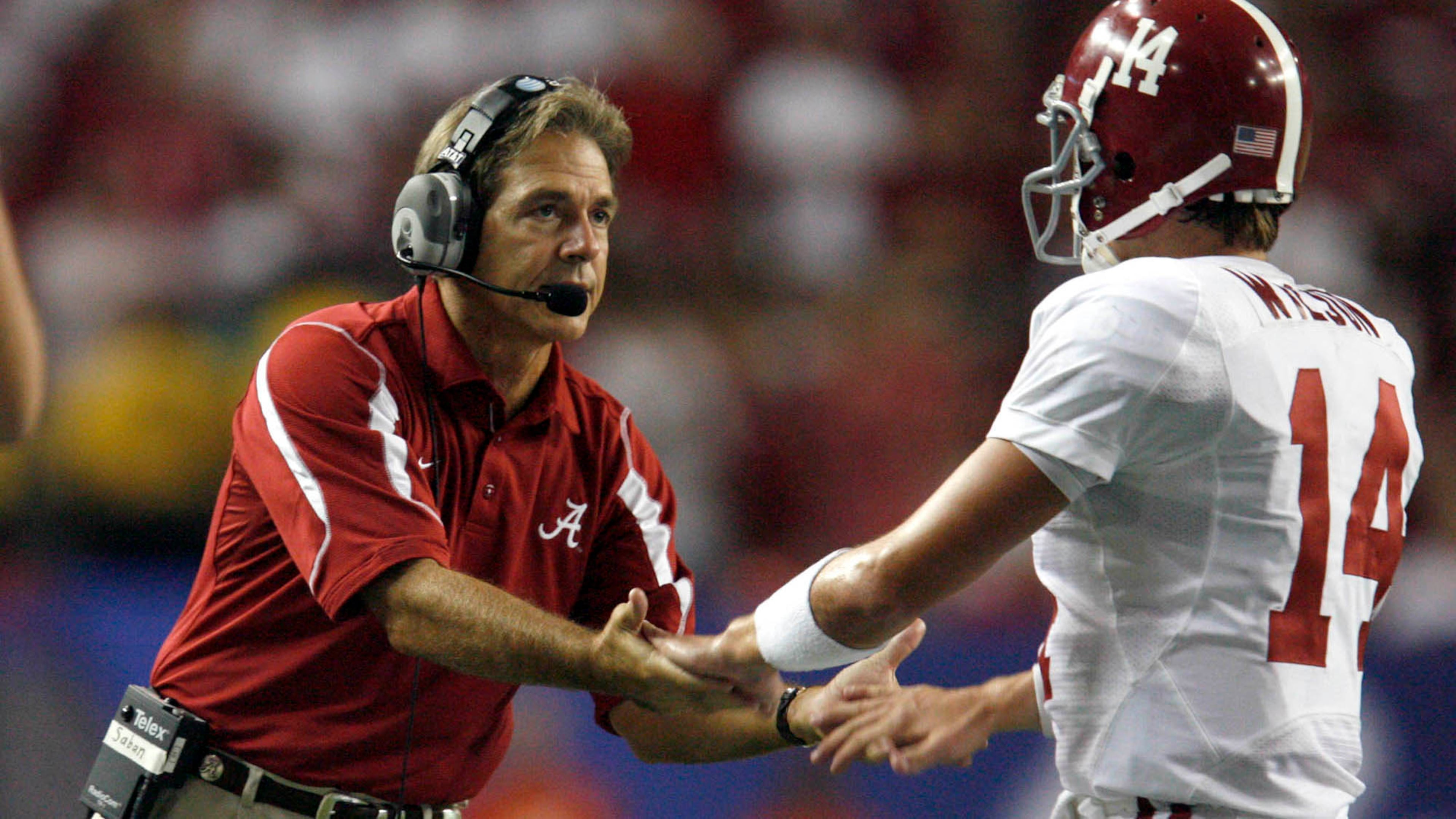 Alabama head coach Nick Saban greets quarterback John Parker Wilson (14) after a field goal in the fourth quarter in their 34-10 in the Chick-fil-A College Kickoff game Aug. 30, 2008, at the Georgia Dome in Atlanta.