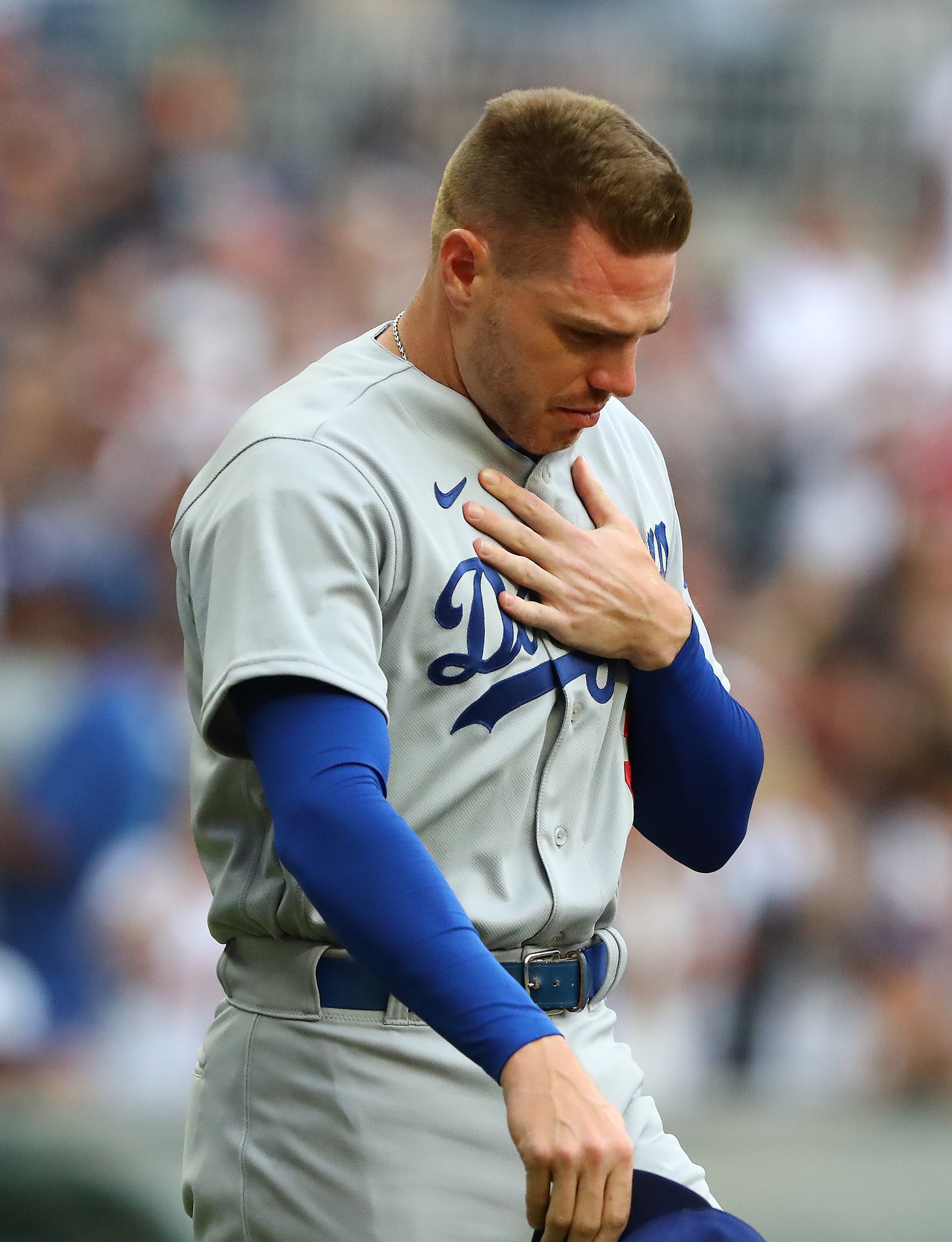 062422 Atlanta: Former Atlanta Braves first baseman Freddie Freeman puts his hand on his chest fighting back emotions as he takes the field for his World Series Championship ring presentation as he returns to Atlanta with the Los Angles Dodgers for a MLB baseball game on Friday, June 24, 2022, in Atlanta. The series marks Freeman’s first games in Atlanta since the longtime Braves star signed with the Dodgers as a free agent in March. “Curtis Compton / Curtis.Compton@ajc.com”