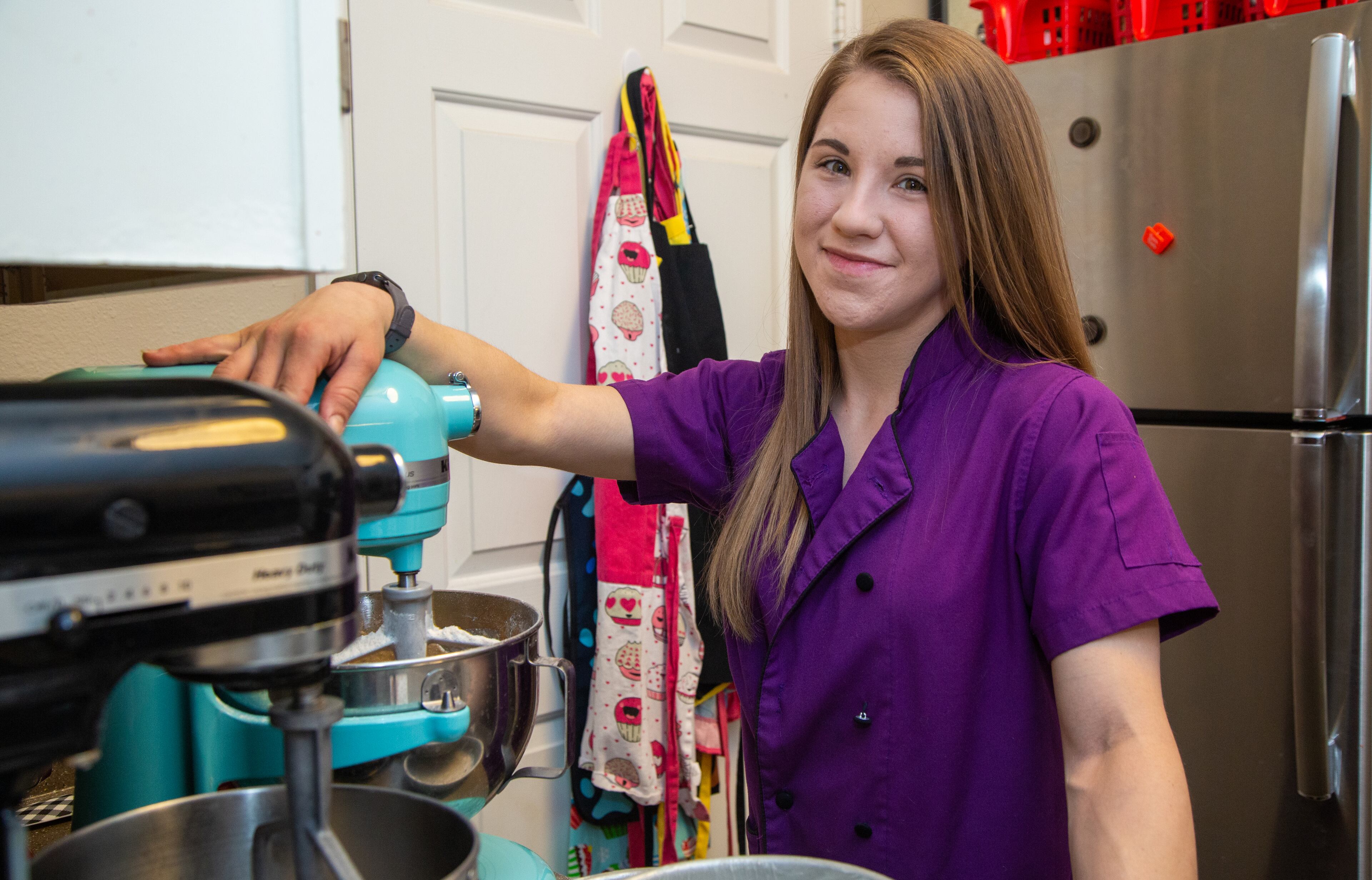 Heaven Waits of Heavenly Bakes works in the kitchen of her Buford apartment. Her business was helped by The Bert Show’s “Save my small business” promotion, which gives free ads to small businesses who have been hit hard by the pandemic. PHIL SKINNER FOR THE ATLANTA JOURNAL-CONSTITUTION.