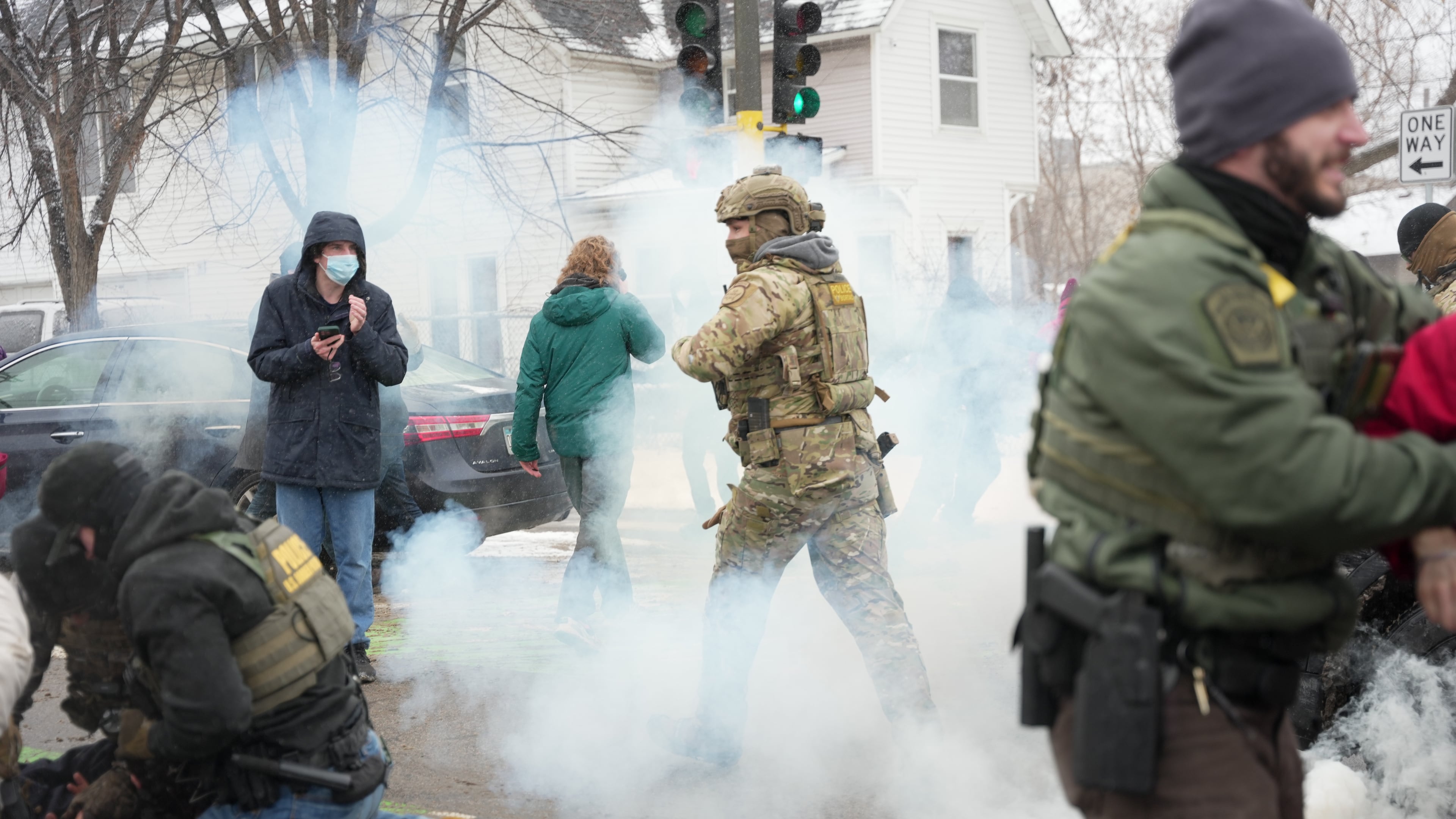 Tear gas is deployed as Federal agents make arrests on Wednesday, Jan. 21, 2026, in Minneapolis. (AP Photo/Angelina Katsanis)