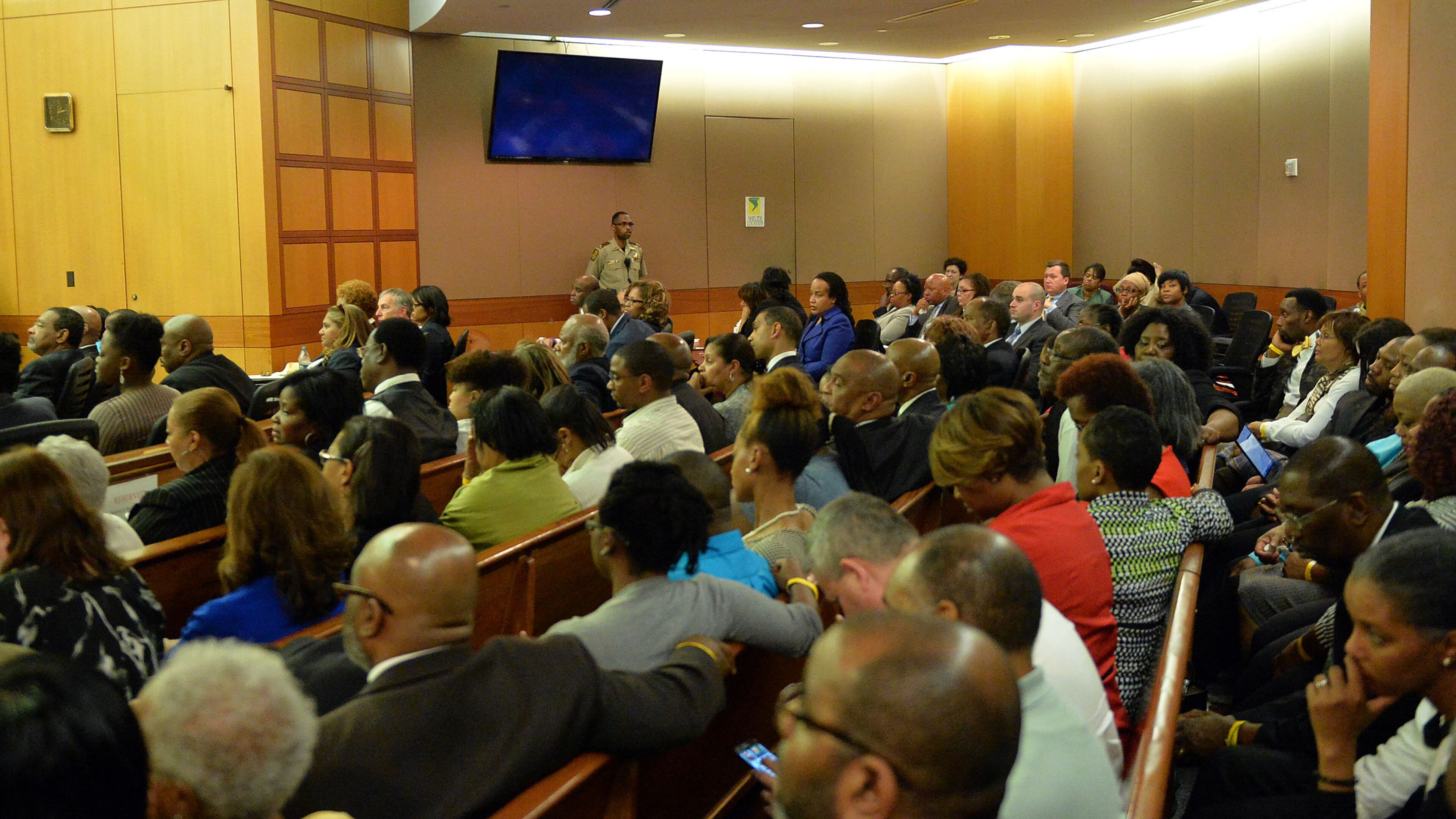 Defendants and their defense attorneys (rear) sit in a packed courtroom Monday. Sentencing of 10 of the 11 defendants convicted of racketeering and other charges in the Atlanta Public Schools test-cheating trial before Judge Jerry Baxter in Fulton County Superior Court, Monday April 13 2015. (Atlanta Journal-Constitution, Kent D. Johnson, Pool)