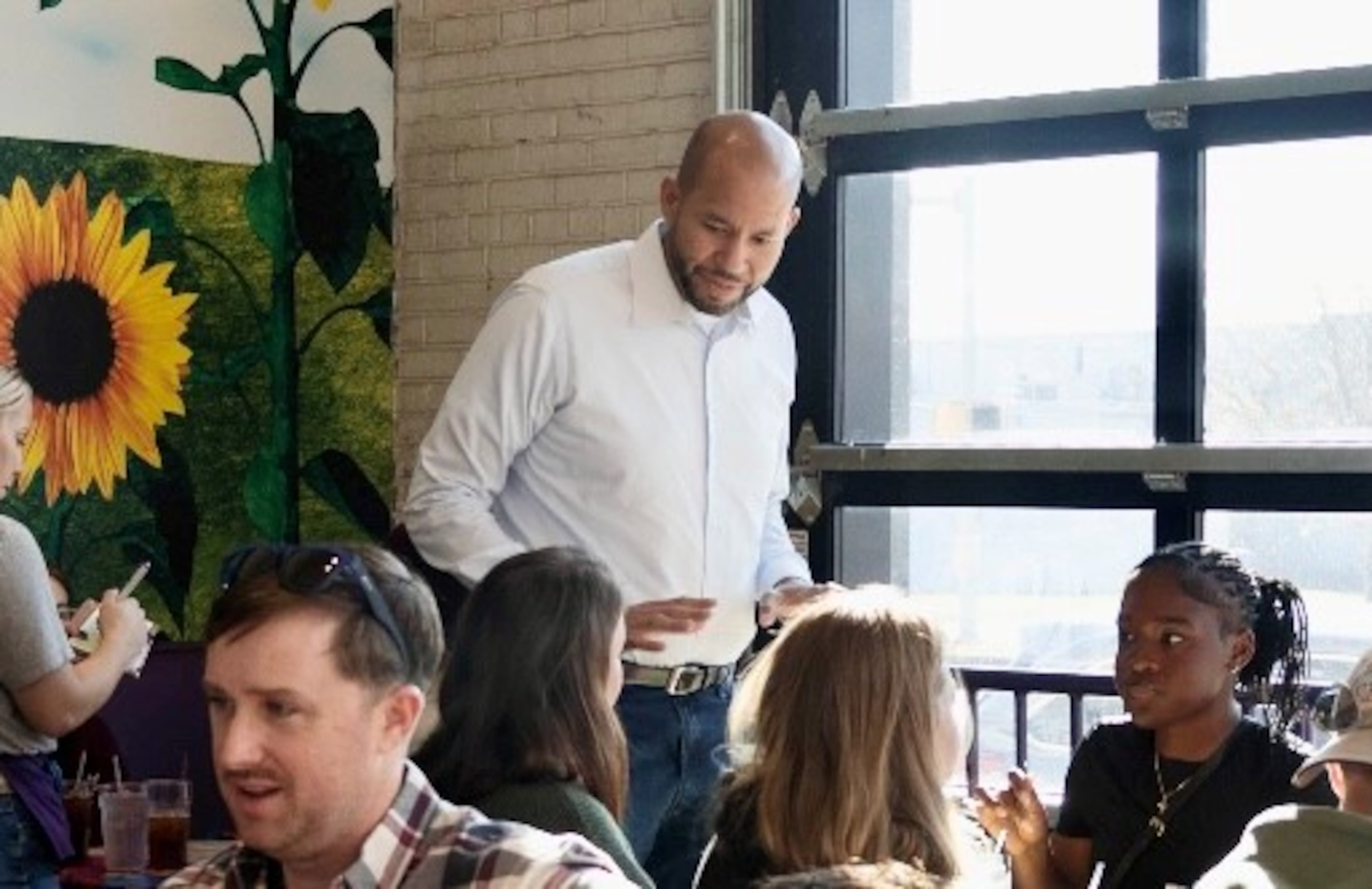 Democratic gubernatorial candidate Jason Esteves checks on customers at his Flying Biscuit restaurant in Columbus during a busy Saturday brunch. Esteves and his wife own a second Flying Biscuit in Macon, along with an urgent care facility in the Atlanta area. (Anna Girzone for the AJC)