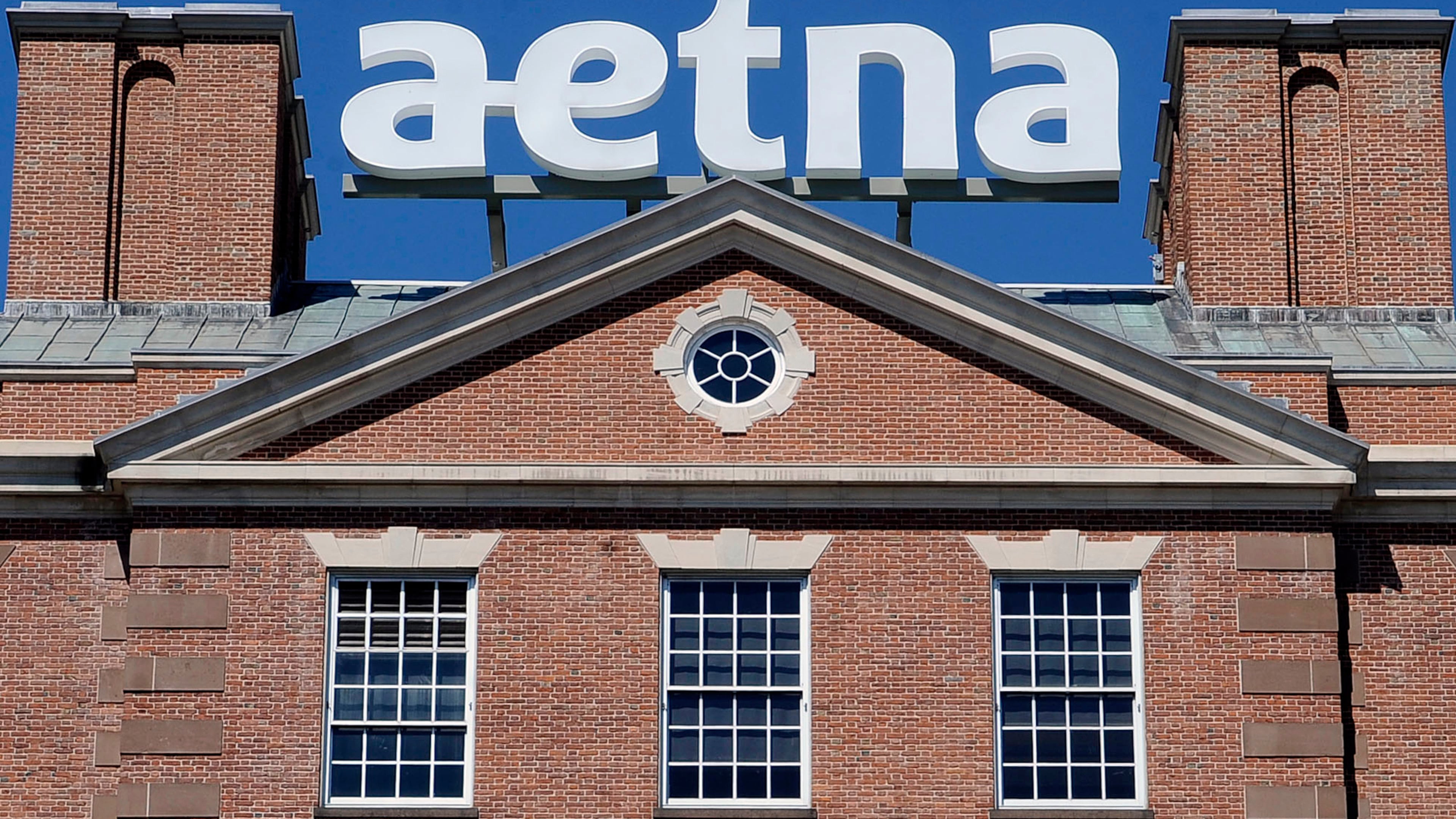 FILE - The corporate sign atop Aetna headquarters is seen Aug. 19, 2014, in Hartford, Conn. (AP Photo/Jessica Hill, File)