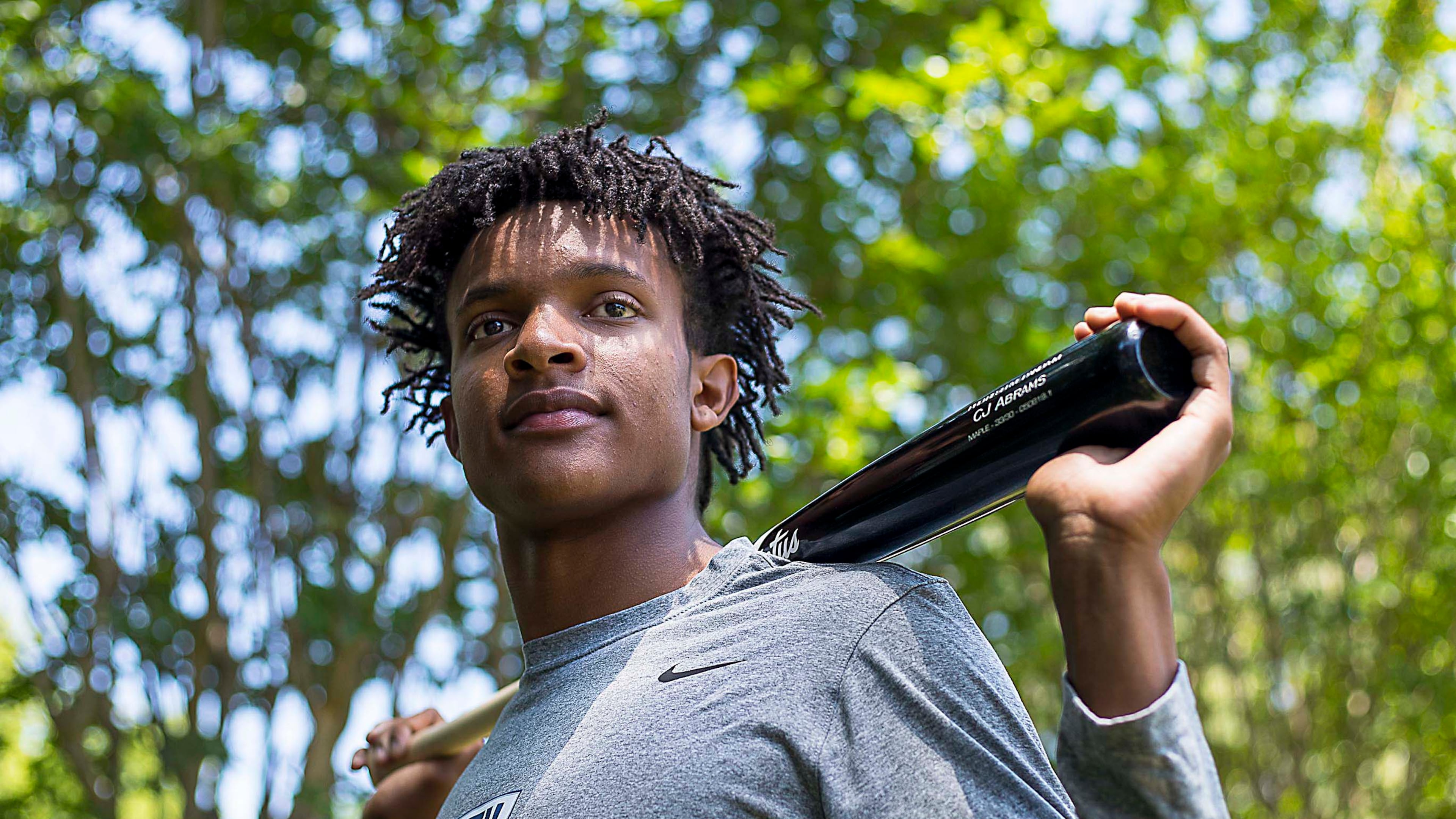 Before Monday's Major League draft, C.J. Abrams strikes a pose outside his family's Alpharetta home. (Alyssa Pointer/alyssa.pointer@ajc.com)